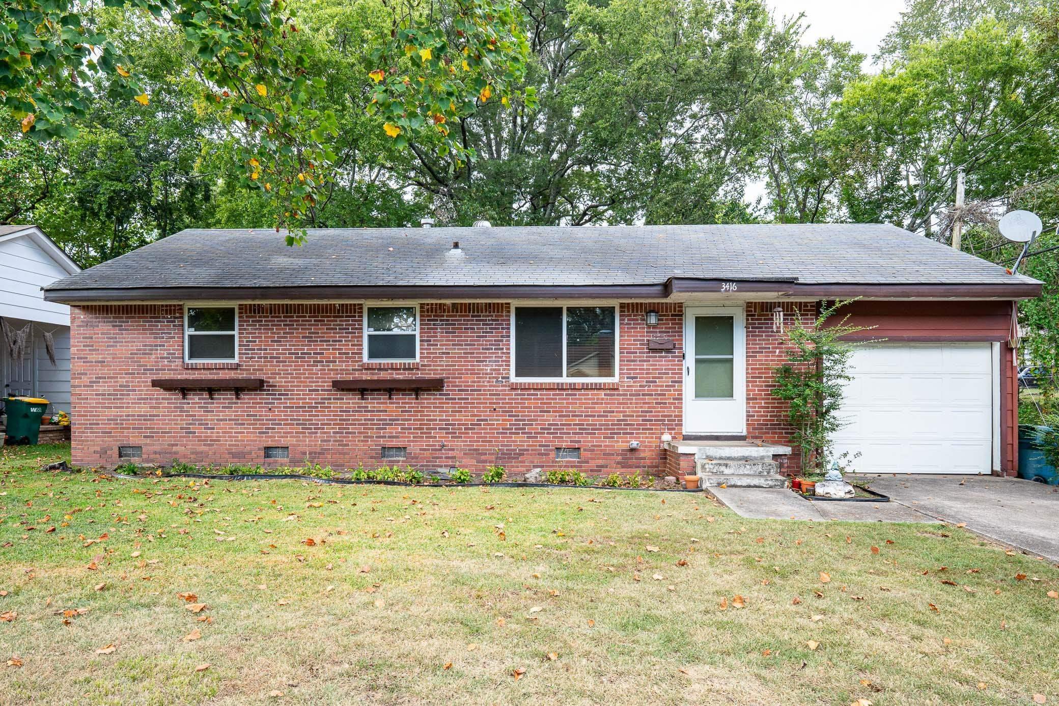 Welcome Home to 3416 W Capitol, located just east of UAMS about 4 blocks. This one level brick home features 2 bedrooms and 1 full bathroom with open living room and updated kitchen. The large kitchen features quarts countertops, updated appliances, tile floors, eat in kitchen/dining area and breakfast bar. Refinished hardwood floors and crown molding in the living areas and bedrooms. The bathroom was updated with new fixtures and flooring. The laundry room is in the attached one-car garage. This home currently requires flood insurance, owner is willing to pre-pay 2 years with acceptable offer. Agents, please see remarks.