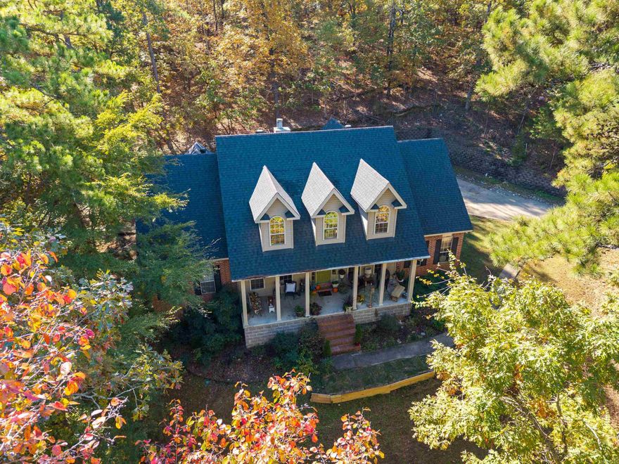 Welcome home to 1215 Top Hill, a beautifully maintained property set on 2.3 acres inside a private gated community in West Pulaski County. This spacious home features the primary suite on the main level with an en suite bath offering his-and-hers sinks and closets, a shower, and a jetted tub. Two additional bedrooms and a full bath are also located on the main floor. The kitchen was updated in 2016 with custom cabinetry, granite countertops, stainless steel appliances, and a breakfast bar, opening to an inviting living room with a wood-burning fireplace and a formal dining area. Upstairs, you’ll find a large bonus room filled with natural light from its three charming dormer windows. Two additional bedrooms are also located upstairs, including one with a private full bath featuring double sinks. The amount of extra storage space upstairs is truly impressive, offering multiple walk-in and easily accessible storage. Enjoy peaceful outdoor living on the covered back porch overlooking wooded views, a terraced retaining wall, firepit, deck, and storage building. A perfect blend of comfort, space, and privacy. Roof replaced in 2022. Conveniently located to shopping & interstate.