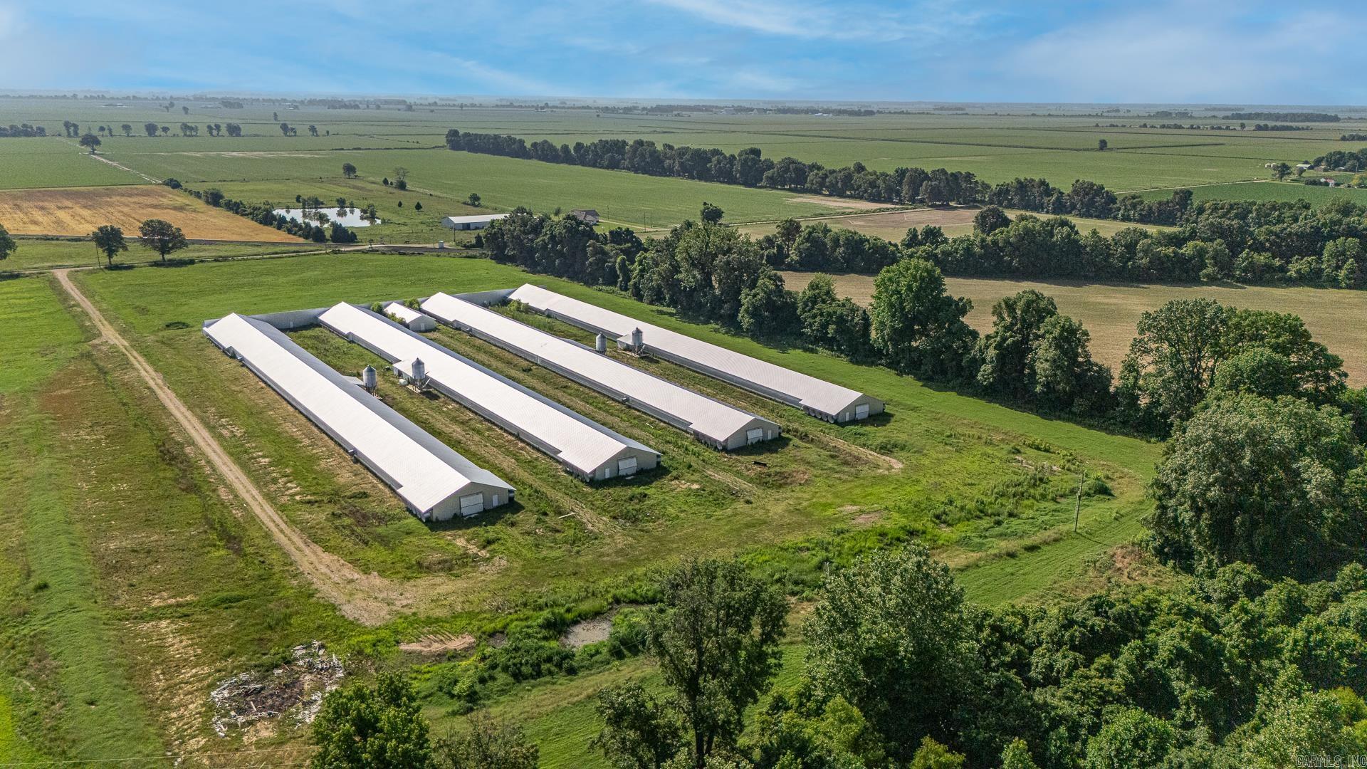 Fully Equipped Chicken Farm operation designed for productivity and ease on approx. 37 acres. Built in 2022 this farm features 4 - 42 x 500 state of the art breeder houses outfitted with modern poultry technology. Complete with an egg haul and lift, Automated egg packer with extra parts for the conveyor, Diesel Motor Generators as well as power ran directly to the property, Rotem System, Automation scales for streamlined production, 2 wells located on the property and a Breaker box located at every house for convenience with gravel/rock drives accessible by Semi's/Trucks/Etc. This property also includes a 30x40 shop built in 2023. This farm is idea for serious agricultural investors or farmers looking to expand into a breeder poultry farm.**See Agent Remarks**