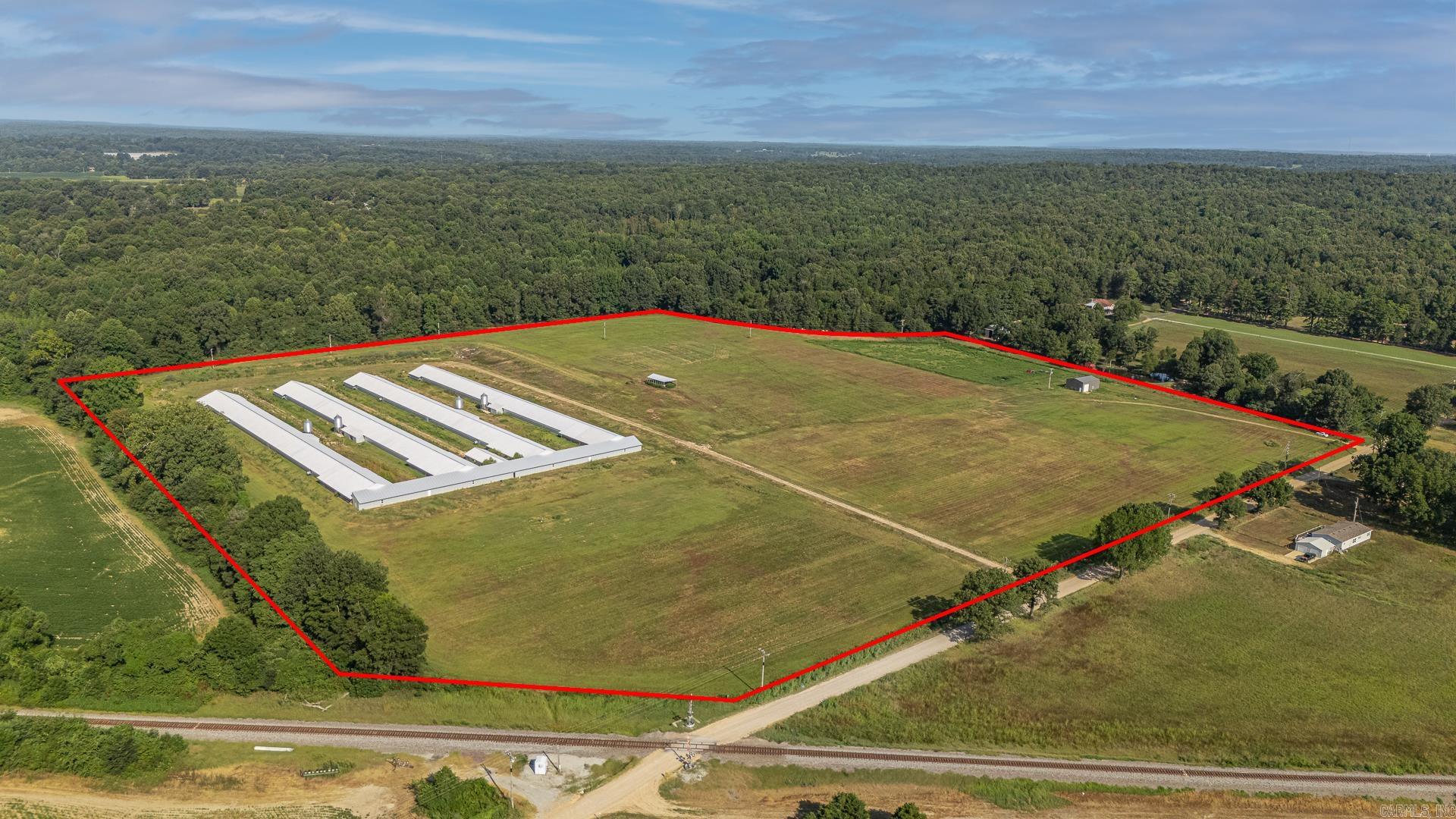 Fully Equipped Chicken Farm operation designed for productivity and ease on approx. 37 acres. Built in 2022 this farm features 4 - 42 x 500 state of the art breeder houses outfitted with modern poultry technology. Complete with an egg haul and lift, Automated egg packer with extra parts for the conveyor, Diesel Motor Generators as well as power ran directly to the property, Rotem System, Automation scales for streamlined production, 2 wells located on the property and a Breaker box located at every house for convenience with gravel/rock drives accessible by Semi's/Trucks/Etc. This property also includes a 30x40 shop built in 2023. This farm is idea for serious agricultural investors or farmers looking to expand into a breeder poultry farm.**See Agent Remarks**