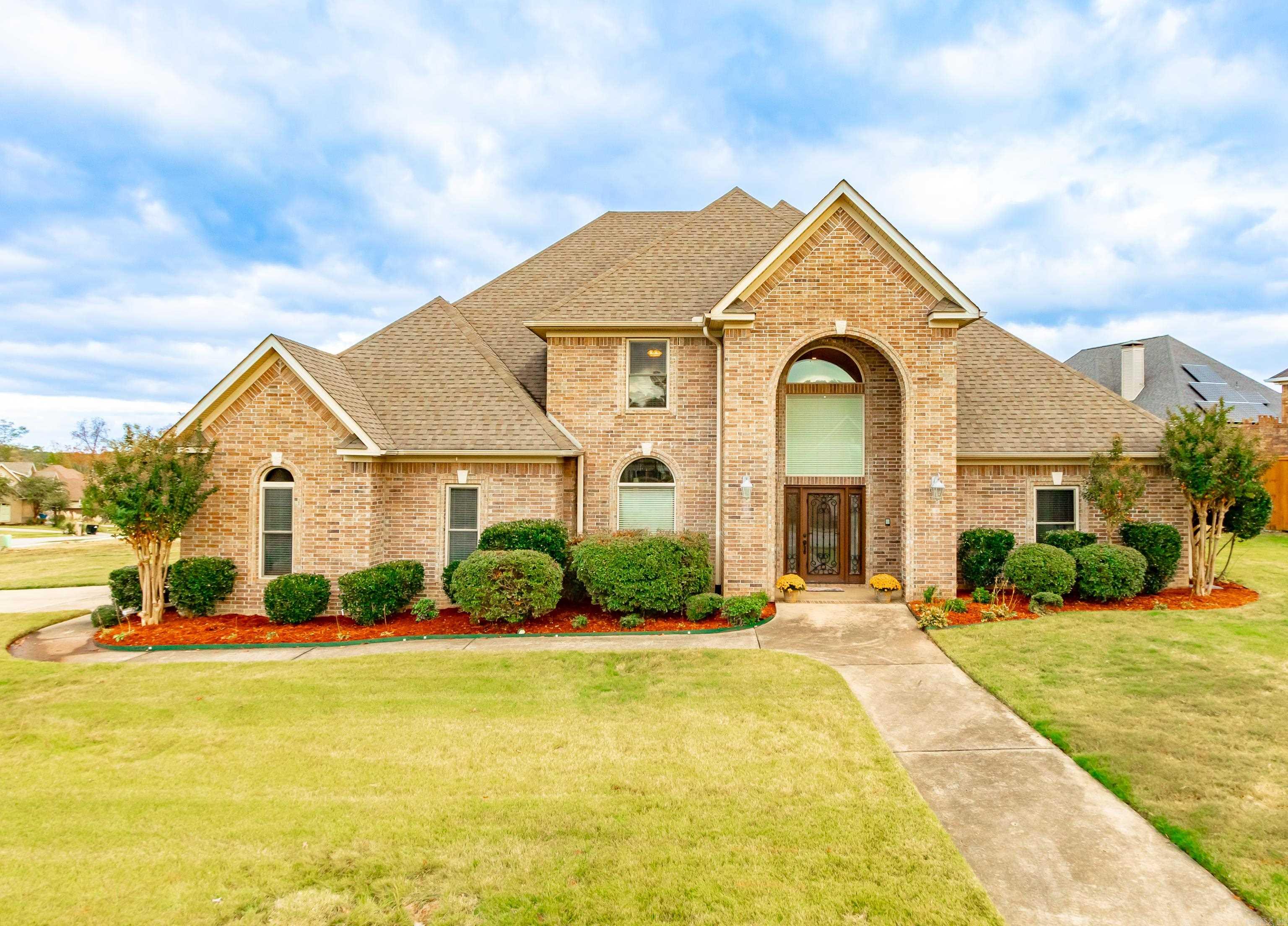 Stunning 4-Bedroom home with spacious interior and Resort-style outdoor living! Open foyer, hardwood floors, spiral staircase with balcony, two living areas, hearth room off kitchen. spacious kitchen has large Island, tons of custom built cabinets ceramic tile, and built-in Captain cabinet. Breakfast area, gas fire place. Master suite with generous sitting area, master bath has jetted tub, walk-in shower, dual walk-in closets. Upstairs has three large bedrooms, one with an en-suite full bath and large game room, intercom system through-out, ceiling fans in every room. Step out master bedroom to 16 x 36 in-ground pool, privacy fencing, basket ball area, zone heating/air, sprinkler system, Zoysia grass and back, 8 x 10 storage building. Much more! Come have a look see! See Agents Remarks!