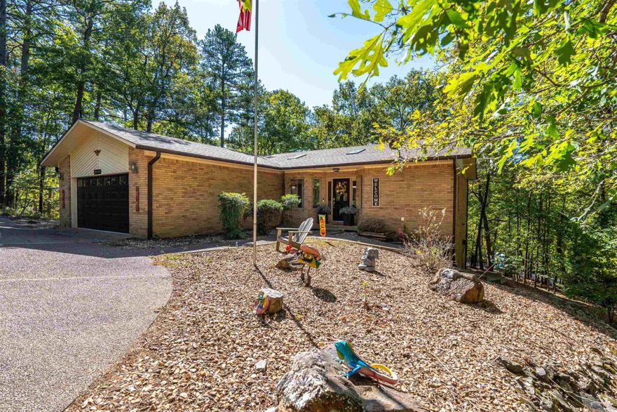 Welcome to this beautiful 2878sf home nestled in lush green landscape in the heart of Hot Springs Village. This property is sure to impress you with its spacious open floor plan and fabulous natural landscape views. The main level of the home is 1457sf with 2 bedrooms and 2 bathrooms. As you walk downstairs to the lower level (additional 1421sf), you will find a craft/hobby space, the 3rd bedroom, and a bonus room that can be used as a 4th room. Also, downstairs is the 3rd bathroom, large laundry room, and an oversized storage room spanning the width of the home. Additional property features: New Roof late 2020, New HVAC late 2019, New Appliances 2020, 2 New Patio Doors 2022, New Skylights 2023. Come discover all the stunning features and benefits of this property and how you can call this wonderful property, "Home"! Call today to set up your appointment for a special grand tour. Note: Agents, please see additional remarks for more important information. Sellers offering $5,000 credit at closing to buyer with an acceptable offer that can close by January 15, 2024.