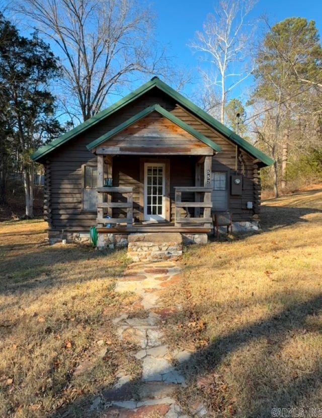 WHERE MOTHER NATURE IS THE MAJOR DEVELOPER! Designed for leisure, this remote cabin is the ultimate HIDE-A-WAY! Tucked away in the quaint town of Calico Rock, this one-bedroom cabin is nicely situated on 10.3 ACRES and located within minutes from both Calico Rock AND the beautiful White River. Whether you are looking for a weekend get-a-way or off the grid living, this unique property is perfect for both. Enjoy the sweet sounds of creek water from your front porch OR live here and build your forever cabin on one of the amazing hill tops. With a 36X36 barn, pasture AND wooded acreage little cabin on Little Creek Lane offers a private, peaceful and PERFECT setting!