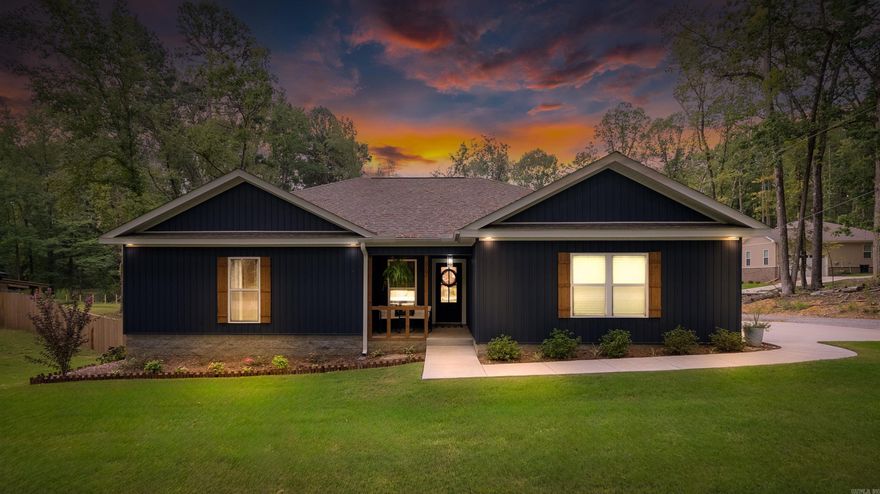 Why wait for new construction? Built in November 2023, this move-in ready 3 bedroom, 2 bath home has all the extras already done for you. Inside, the open-concept layout showcases wood ceiling beams, a modern LED electric fireplace, and black granite counters throughout. The primary suite offers a private retreat, while two additional bedrooms and a second full bath provide flexibility for family, guests, or a home office. Step outside to nearly half an acre with a horizontal wood privacy fence, landscaping, and a brand new workshop with air conditioning. There are two gates for boat or RV parking in the back. The 2-car garage and extra parking pad adds even more convenience. Bauxite Schools! Make this one yours today.