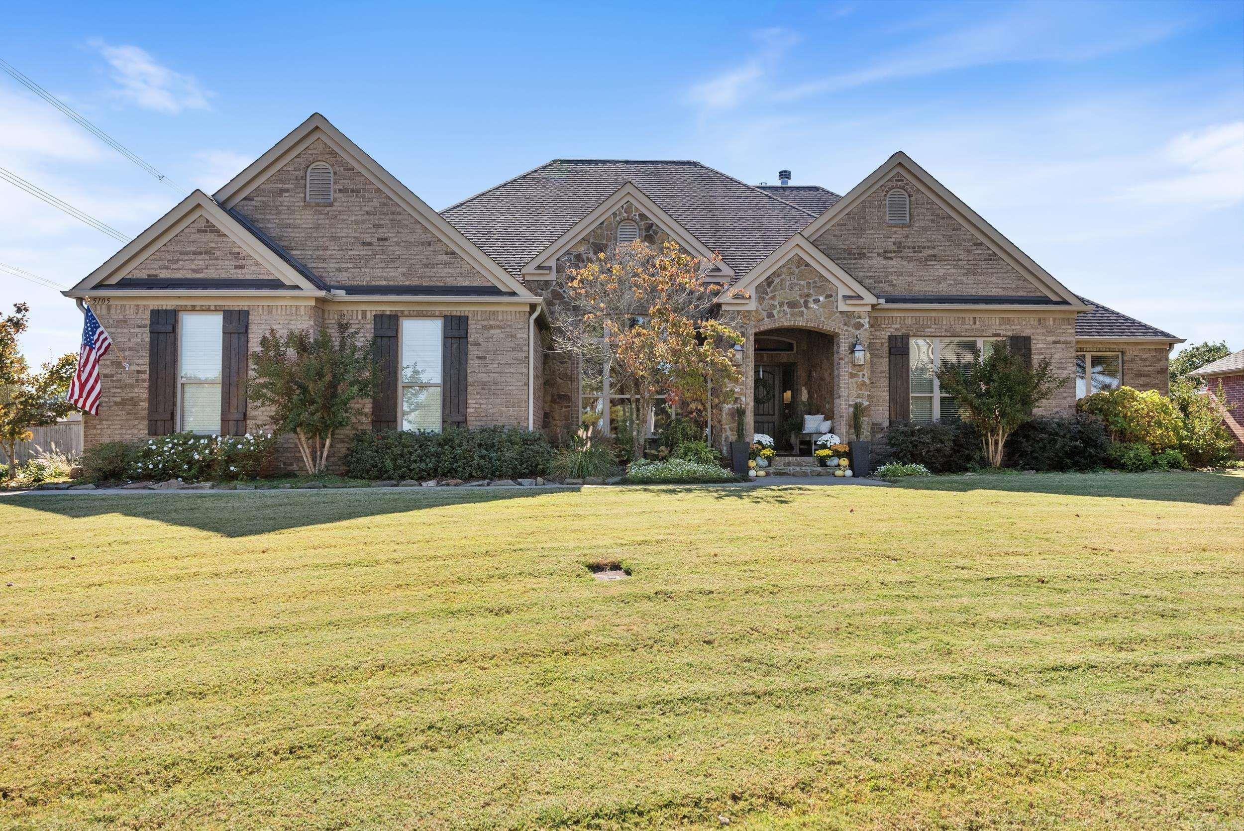 Welcome to your dream home in Fieldstone subdivision! This beautifully maintained residence features a split floor plan w/ 5 spacious bedrooms & 4 pristine baths. The immaculate kitchen features a center island with a butcher block countertop, granite surfaces, stainless steel appliances; double ovens, gas range, wine refrigerator, breakfast bar & a roomy walk-in pantry, the kitchen flows seamlessly into the inviting hearth room. The living room, adorned with stunning coffered ceilings w/ a cozy gas fireplace sets the stage for cherished memories. The formal dining sits off the foyer w/ 12' ceilings. The primary suite is a true retreat, showcasing a luxurious bathroom complete with a soaking tub, walk-in tile shower, double vanities, & a dedicated makeup vanity. The custom closet is a dream come true, featuring a large center island with drawers, ample shelving, & all the thoughtful extras. Two downstairs bedrooms share a jack-and-jill bath & walk in closets,  the fifth bedroom, located upstairs, offers potential as a bonus room & includes a full bath. The sunroom, or man cave has a wood-burning fireplace w/ tongue & groove ceiling opens to a screened-in porch.