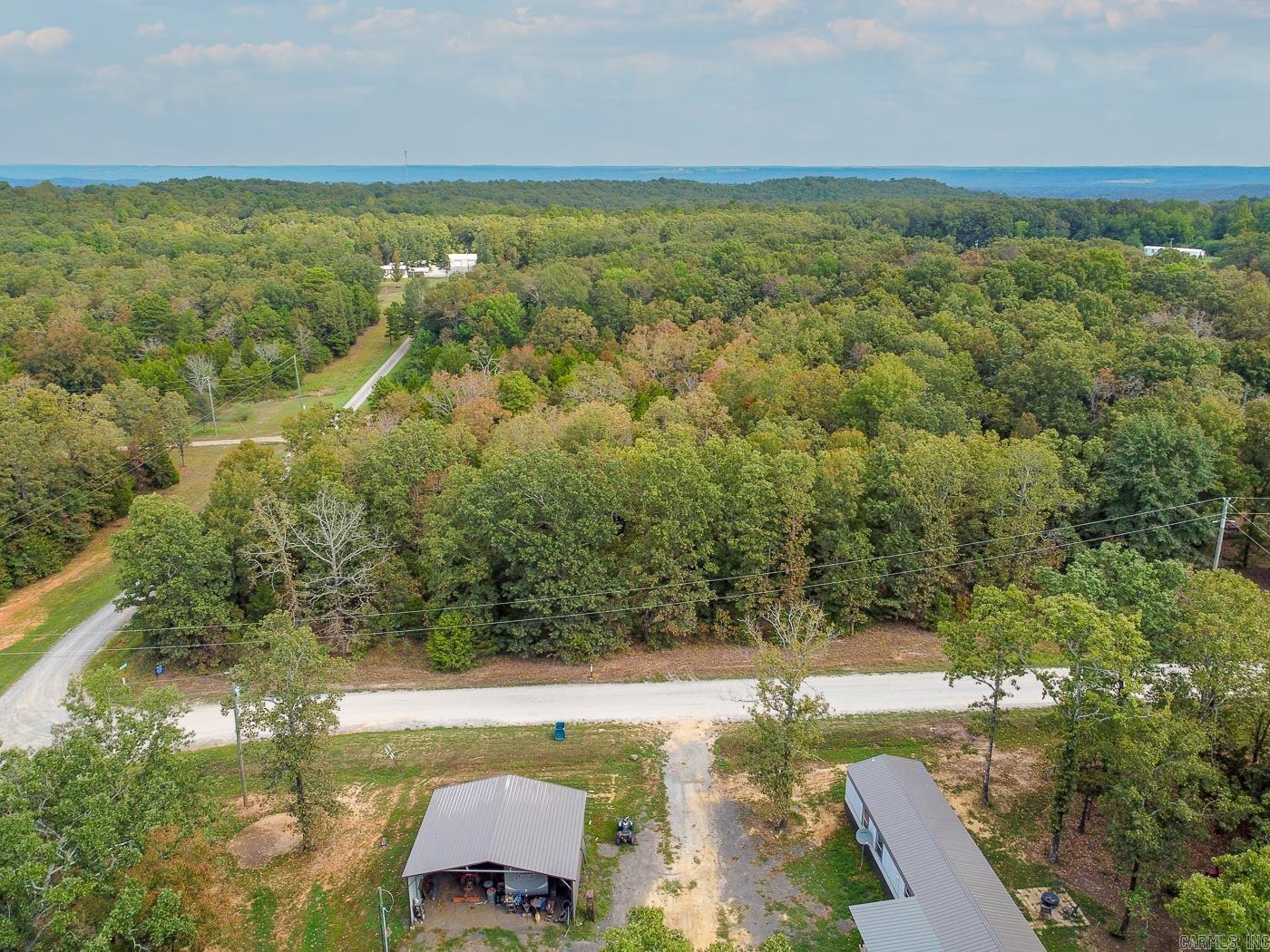 Welcome to 244 Crooker Ranch Rd in Searcy! This is a 3+/- acre unrestricted corner lot. Tucked away on a quiet dirt road, the property is surrounded by trees for natural privacy while still having utilities nearby for easy hookup. With no restrictions, you have the freedom to build your dream home, place a manufactured home, or create a peaceful weekend retreat. Enjoy the charm of rural living with plenty of space to spread out, all just a short drive from the conveniences of town. Whether for personal use or investment, this wooded property is a rare find in White County.