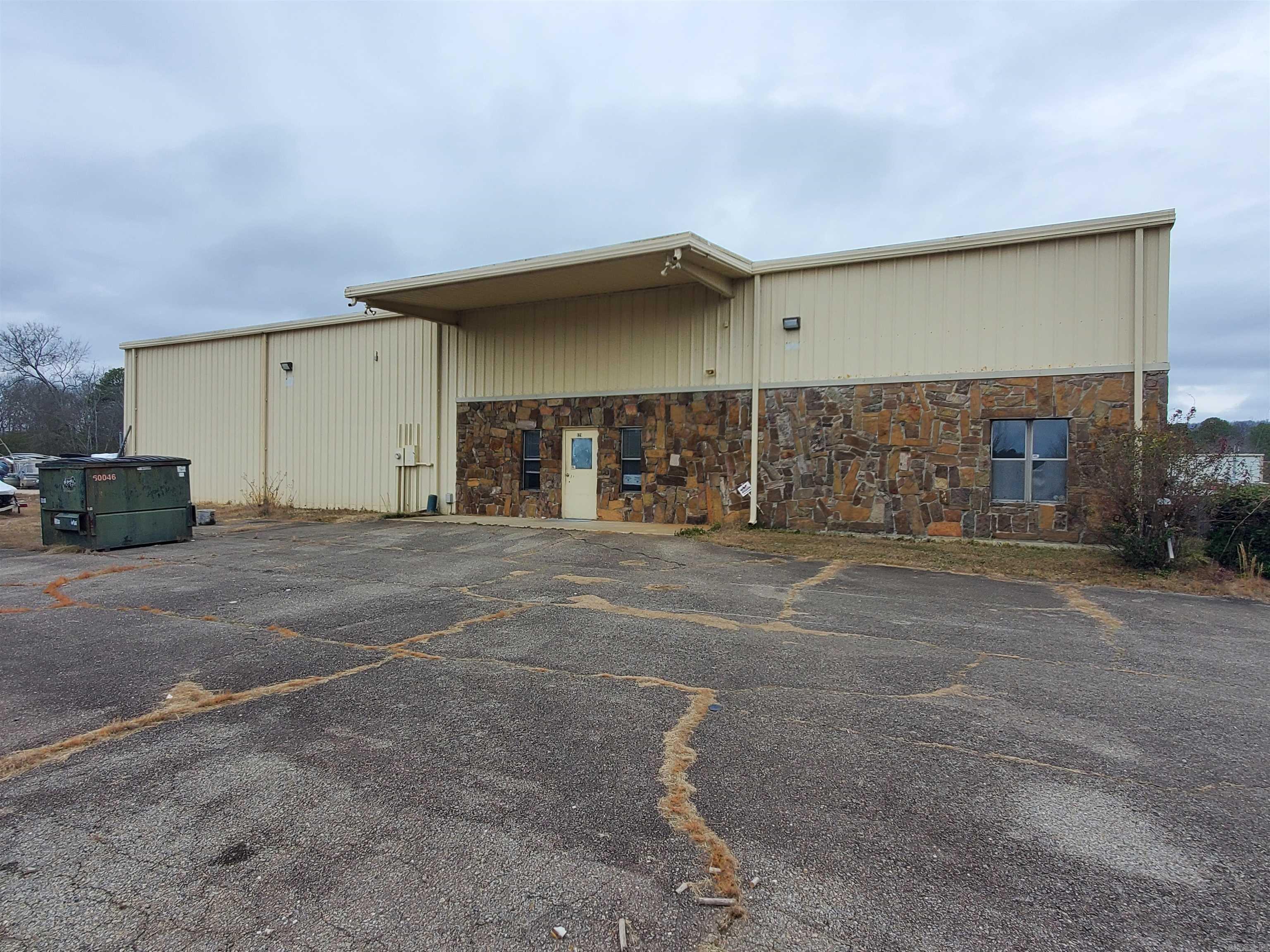 10,000sf Warehouse on 5.5-Acres in Mid-America Industrial Park, Gated Paved Entrance, Office Sace and a Break Room in the Front Right of the Warehouse, Multiple powered overhead doors, Loading Dock, LED Lighting in Warehouse area and Office area, Rubber Coated Metal Roof, Lots of Outdoor Flat area.