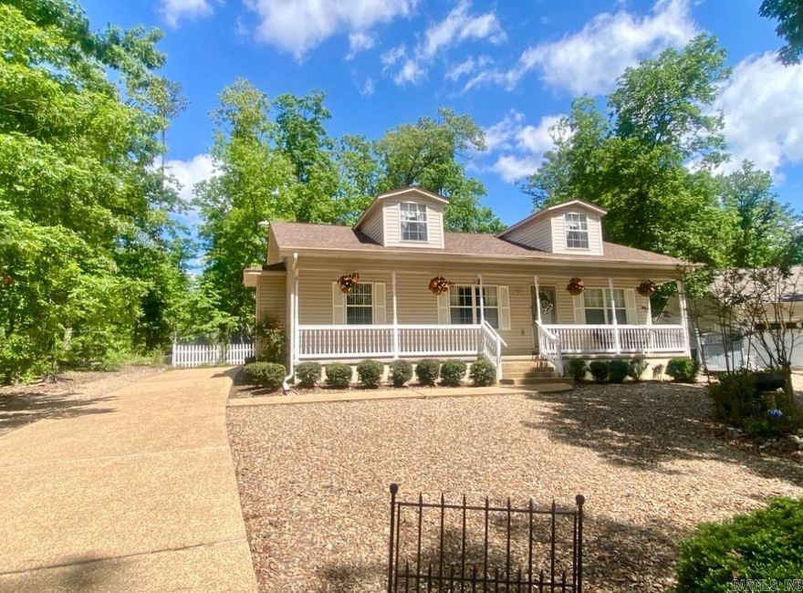 OPEN HOUSE SAT 12-2!! Your Cottage in the Woods... move-in ready, in a private cul de sac, with an inviting large front porch and a 2 car garage in back! Warm and Cozy the second you walk in...you'll love the soaring ceilings in the great room, the spacious dining area, and the sparkling kitchen with lots of counter space a pantry!  A lovely sunroom on the back gives you a place to connect to nature with no neighbors in sight. With this awesome split bedroom plan, you get privacy in your primary suite, while offering two bedrooms and a full bath on the other side of the home for guests or an office. You'll love the updated primary bathroom with a huge double vanity, separate shower and toilet area, and TWO closets- one is a large walk in! The spacious laundry room is a plus, and the oversized two car garage comes with great built in's and a handy sink. Attic space is up for storing all your Christmas and extras. Pristine home, and the seller is transferring over their Choice Home Warranty through December 6 of 2028. Make your appt. today! All furnishings and some decor are negotiable with seller after an accepted offer.  POA one time $2,000 buy-in fee required.