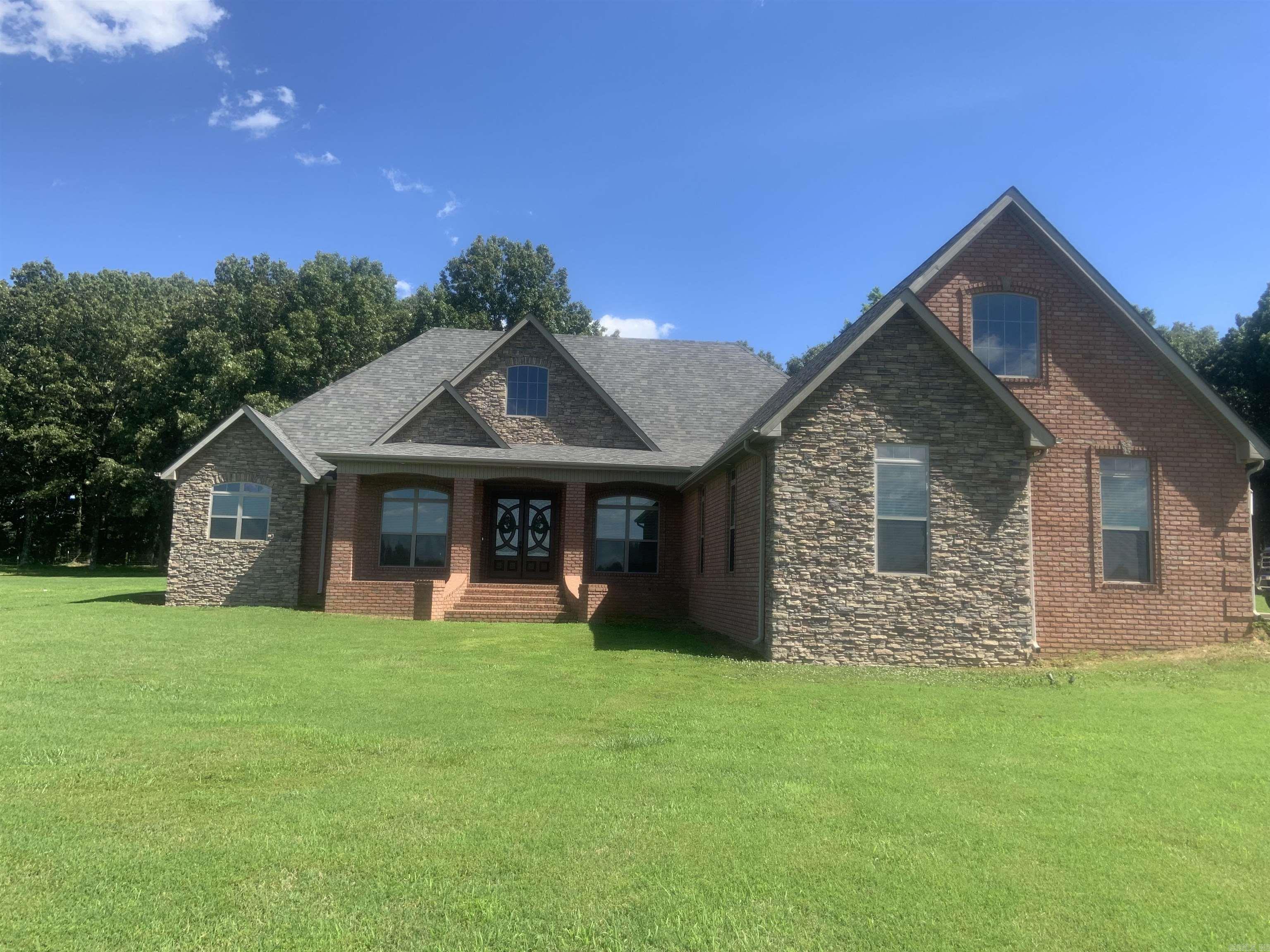 Brick/Vinyl, 3br, 2.5 ba. LR w/wood burning insert, Kit. w/Birch cabinets w/formica counters, breakfast bar & breakfast room. Sun Room off hall, could be a bedroom. Nice screened-in porch off breakfast room. Lg. Primary BR with two walk-in closets, Primary bath w/linen closet, two separate vanities, whirlpool tub & sep. shower. Walk out basement w/large room and bedroom area and half bath. All neutral colors, flooring is carpet and vinyl, This listing consist of two houses, 30 x 40 barn, sm, animal shed metal carport, 20 acres w.small pond. See MLS #24020445