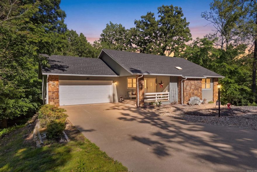 Welcome Home! Charming, updated, and move-in ready! This 2,062 sq ft home sits on a spacious half-acre lot with thoughtful updates throughout. Two bedrooms on the main floor, plus a lower-level bonus suite with a full bath that has its own dedicated parking, no need to navigate stairs. Perfect setup for an in-law suite, guest quarters, or VRBO rental. The walkout basement and brand new back deck open to a peaceful backyard shaded by a natural canopy of foliage with abundant wildlife. Just off the living room, the sunroom offers flexible space for a craft room, home office, or playroom. A 2-car garage plus a 3rd-car covered carport give you plenty of parking for family and guests. Recent updates include: brand new deck, exterior paint (2025), new roof (2022), HVAC (2022), water heater (2024), painted cabinets (2022), engineered hardwood flooring in the living room and sunroom, new appliances and fixtures, and a retaining wall by the carport. Conveniently located minutes from Branchwood Park, Loch Lomond, and both the Highlands and Scottsdale golf courses!
