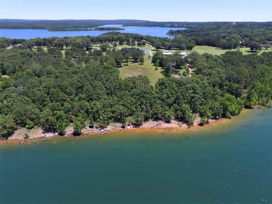 LAKEFRONT 3.43 Acres on Greers Ferry Lake! Many possibilities from one large estate to as many as three homes. West Lake view, good shore line, golf course across the street. Gorgeous property!