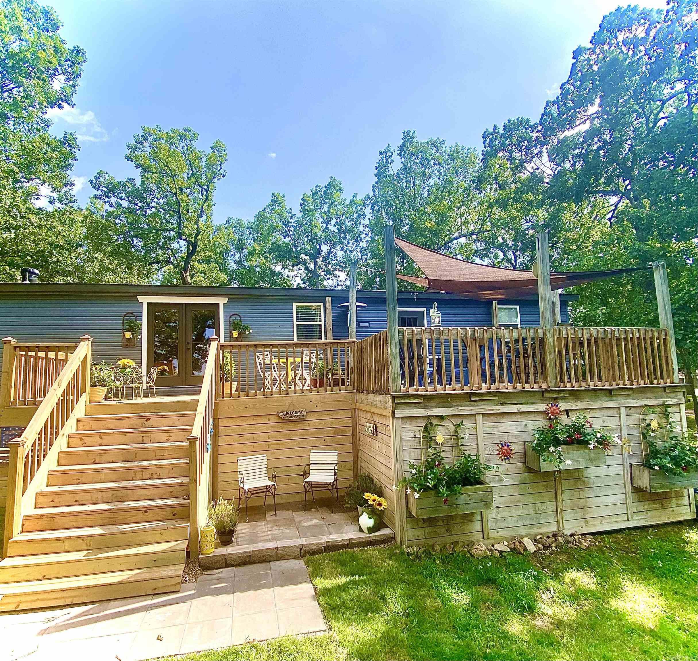 Discover this beautifully remodeled 4-bed, 2-bath home with panoramic Norfork Lake views, located just 3 minutes from Cranfield Boat Dock. Recent updates within the past 3 years include a new roof, a new A/C unit, and a complete interior renovation. Sold fully furnished, itās ready for immediate occupancy or continued use as a proven vacation rental. The open living area showcases stunning lake views and connects seamlessly to the updated kitchen and baths. An expansive deck provides an ideal setting for outdoor gatherings. The property also features a metal carport for boat storage and a spacious storage building for recreational gear. With a strong vacation rental history, this as-is home offers exceptional potential as both a residence and investment. Convenient to boating, fishing, and local amenities, this is lake living at its finest. Contact the listing agent today for a private showing and rental history details. Home is being sold as-is. Expedition Land and Realty Ricky Harris 901-870-7216
