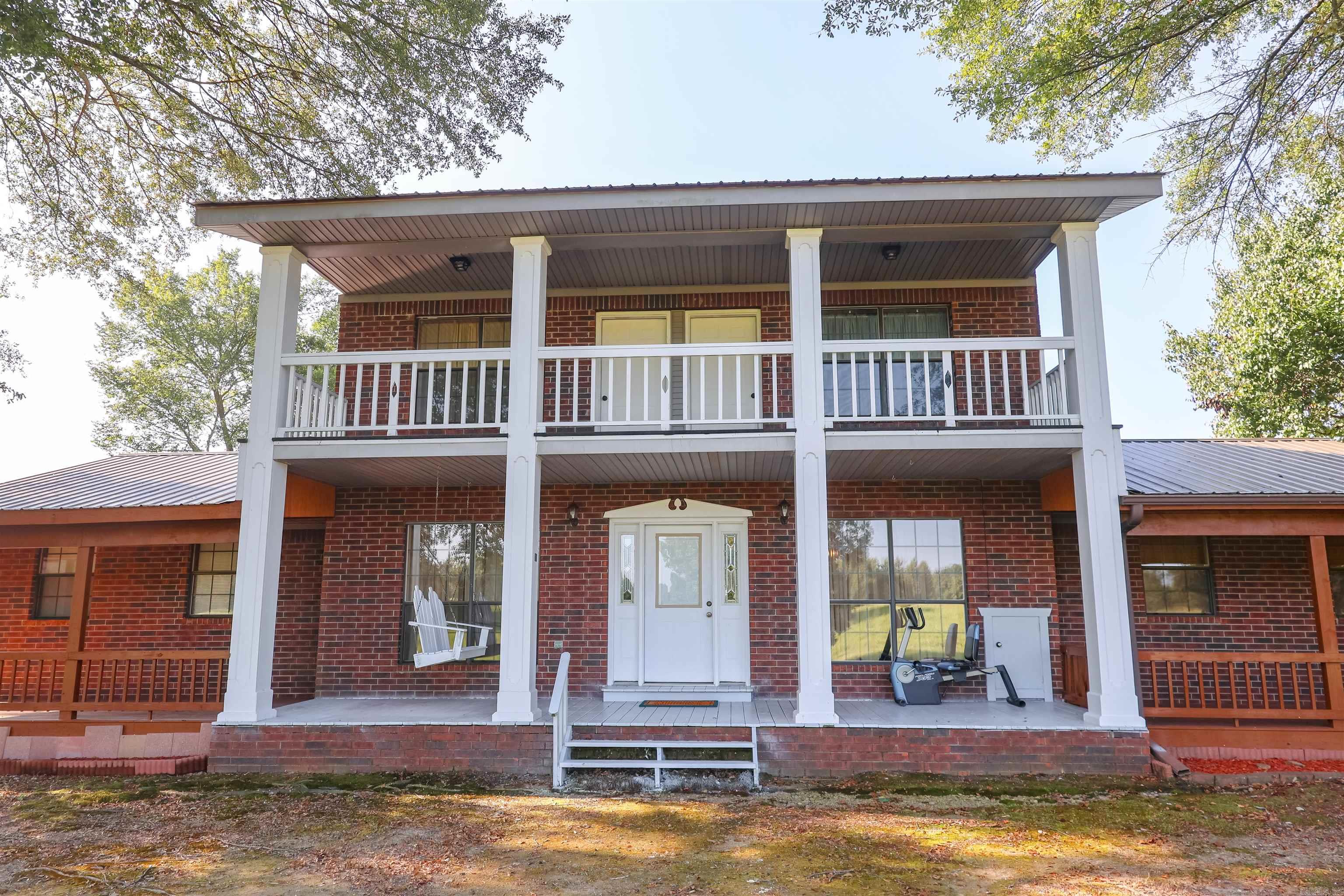 542 Kesterson Road in Dierks, Arkansas, is a spacious 3,000± sq ft home on 2 acres to be surveyed, with extra land available for purchase. The home features 4 bedrooms, 3 bathrooms, and large living areas with solid construction and plenty of space to update the kitchen and bathrooms to your liking. The roof is new. Outside, enjoy covered porches and a balcony with views of the hay meadow, along with established landscaping. The detached 1,440 sq ft garage includes a two-car bay and a finished bonus space that is heated and cooled, can be used for hobbies, a workshop, storage, or relaxing. With a combination of indoor and outdoor space, room to grow, and a country setting while still close to local conveniences, this property offers comfort, versatility, and potential.