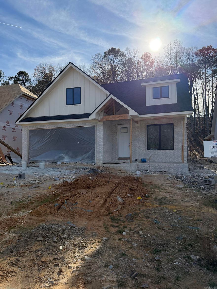 Stunning New Construction Home in the Newly Opened Kinley Ridge Subdivision.. Where Style and Convenience Meet... Amenities Include: Approximately 2042 Square Feet, 3 Bedrooms, 2 Bathrooms, Open Floorplan Concept, Living / Dining Combo, Kitchen / Dining Combo, Large Kitchen Island with Breakfast Bar, Living / Family Room with Gas Log Fireplace, Quartz Countertops in Kitchen Area, Very Nice Appliance package ( Wall Oven, Wall Microwave, Drop in Gas Cooktop ), Split Bedroom Floorplan, Tall Ceilings Throughout, Custom Tile Shower in Primary Bathroom with separate Free Standing Tub, Laundry Room, Pantry, Office Nook, Nice Front Sitting Porch, Covered Patio, 2 Car Garage, Nice Level Lot, Close and Convenient to all of Chenal Area Amenities ( Shopping, Dining, etc.. )... and Much More... A Must See..