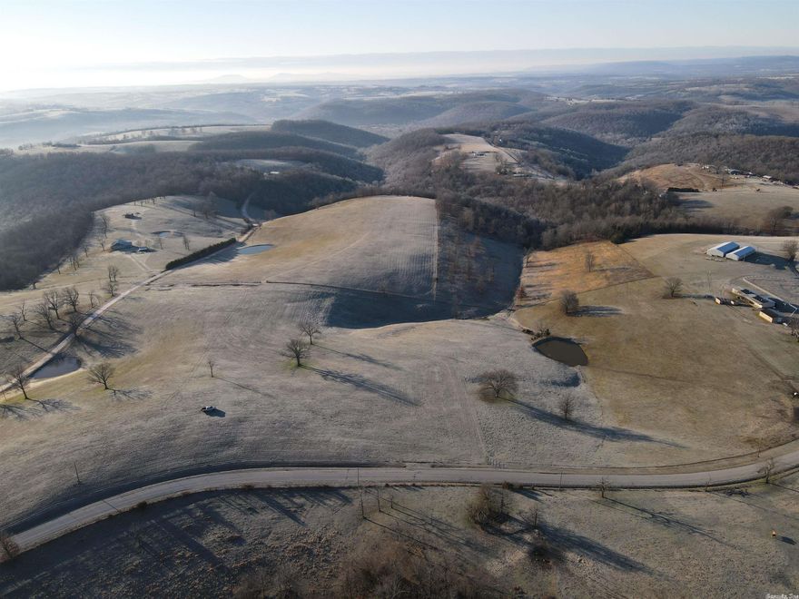 Talk about a find just minutes from town with premium established pastures and immaculate views… check out this rare find. Located off Cottonwood Rd and Debuque Rd just a short distance from Harrison, AR and Branson, MO sets an amazing tract of land with obvious tireless work having been poured into very soil itself. This special farm is loaded with features of which most people just talk about and dream of, but this is where the words met action. As you come to land off the paved county road, you immediately notice the established and very high quality fencing that fully envelopes the tract. Currently the cross fencing provides 5 separate pastures laced with established high yield grazing grasses compromised mostly of fescue. 4 ponds provide ample water for all your livestock needs; the massive ridge tops and rolling terrain combine to supply rain runoff for sufficient water through the dry months. This farm has been maintained with the future and longevity in mind with strategic rotational grazing, quality fertilizing and plenty of recovery time for optimal pasture health. As if this wasn’t enough, along these stunning Ozark hills lay endless building sites for any dream home.