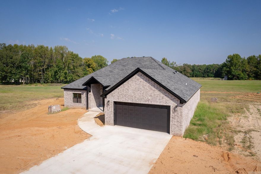 Stunning 4-bed, 3-bath, Approx 2,443 Sq Ft home w/ Large Foyer, Pantry, Covered Front & Rear Porch, Walk-in Laundry, Ultra Open Concept, 4 Large Bedrooms, Kitchen, Large Formal Dining Room or Office, Large Breakfast Area, Bar for Breakfast or Dinner, Stone Counters, Luxury Vinyl Plank Floors, w/Split Floorplan for Bedrooms, & all located on 3+ acres just 10-minutes from town.  RECENTLY COMPLETED NEW CONSTRUCTION w/LOW RESTRICTIONS...NOW ADDING Shop that is approx 24x30x10 w/Power, has Dual Bay Doors w/Concrete Floor and Gravel Drive to Shop too being added now!  Turn Key Ready!  See Agent Remarks.