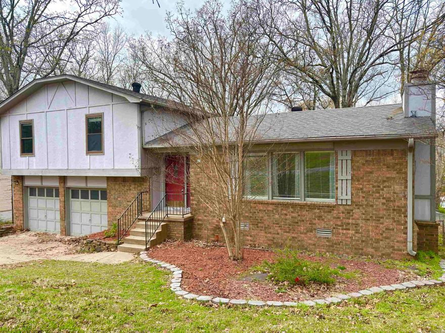 Beautiful, well maintained tri-level brick and wood home in Sherwood, perfect for families! Tons of natural light. This spacious home features hardwood floors, vaulted ceilings, and a contemporary kitchen with open shelving, gas range, and stainless steel refrigerator. Major updates include a new HVAC system (2017), tankless water heater (2017), updated plumbing and fixtures (2024), and fresh paint. New Dishwasher (2021) New ceiling fans (2019) Spacious primary bedroom with walk in closet. Good sized guest rooms. The large, fully fenced yard is perfect for kids and pets, while the serene koi pond and expansive tri-level deck provide plenty of space for family gatherings. Enjoy extra storage in the laundry room and a two-car garage. Move-in ready with modern comforts! AGENTS SEE REMARKS FOR EXCITING DETAILS !