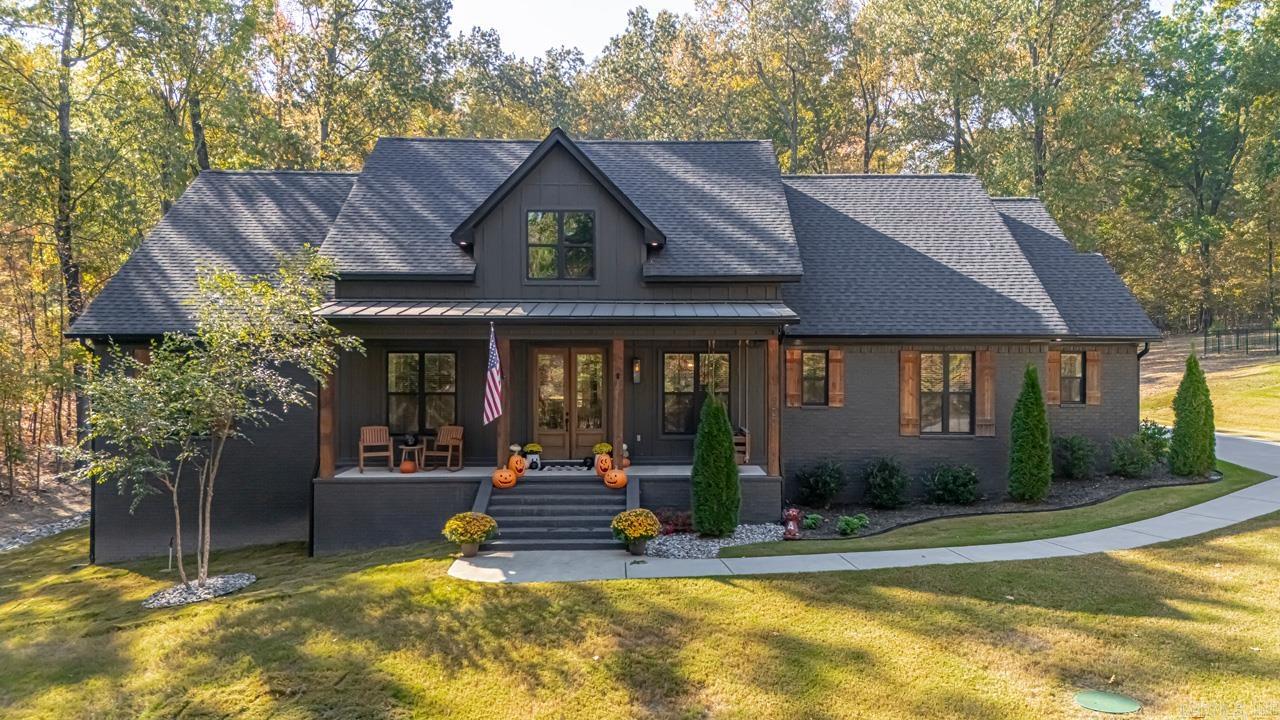 Welcome to 4233 Brody Crossing in Benton, AR - a custom built home where no detail was overlooked. With 4 bedrooms, 3 full baths, 2 half baths, and a huge bonus room, this 3430 sq ft beauty offers both luxury and comfort on a serene 1.63 acre lot. The curb appeal is unmatched, featuring an oversized front porch straight out of Southern dreams. Step inside, and you're immediately greeted by a beautiful accent wall which sets the tone for the many extras throughout the home. The oversized windows flood the space with natural light enhancing the open layout and offering serene greenbelt views from the large backyard. The kitchen is a showstopper, featuring a large island with quartz countertops and an eye catching custom-stained vent hood that is sure to grab your attention. Off to the side, the cast iron sink sits perfectly under a large window, perfect for taking in the views. The spacious master suite includes a freestanding tub and an oversized shower, creating a perfect retreat. Spend your evenings on the inviting screened-in porch, and take advantage of the 30x30 shop for added space. A safe room in the garage adds extra peace of mind. Don't dare snooze! Come see today.