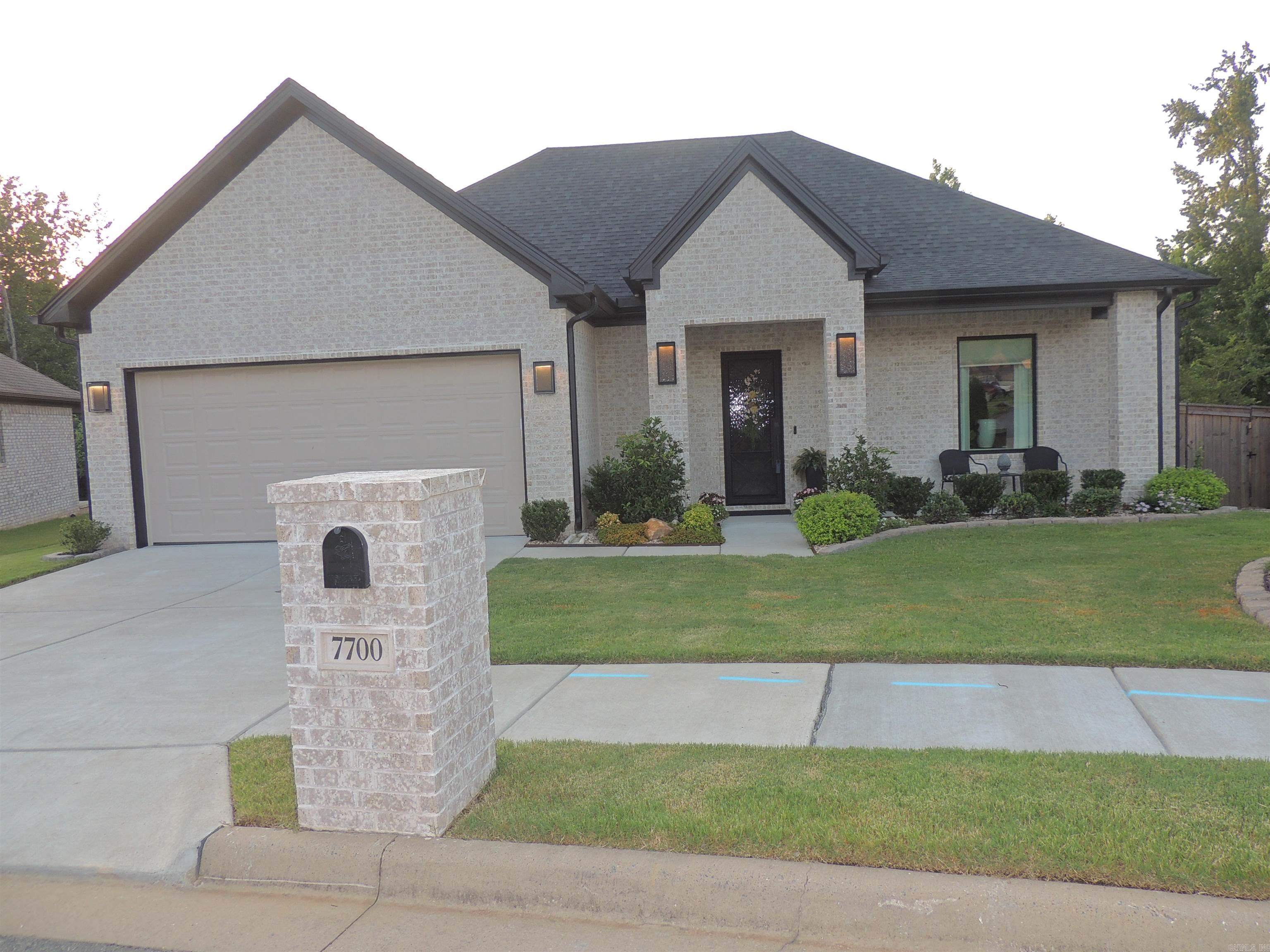 This beautifully designed luxury home will steal your heart away, with all the luxury features you could possibly want! 20 guage luxury laminate flooring, quartz counter tops throughout. Double ovens, large porcelain sink, pot filler above the gas cooktop, trash rollout and a walk in pantry. 10 ft ceilings with 8 ft doors. Primary bedroom has a large walk-in closet. Get ready to enjoy this soaker tub and walk-in shower. Second bath has a porcelain tub and subway tile. Lovely screened in patio with an additional patio for grilling. Beautifully designed landscaping comes with a sprinkler system as well. The door to the far left in the garage goes to a walk up floored storage. Concrete bench and urn in landscaping are family heirlooms and don't remain. Don't wait! Schedule your showing today!