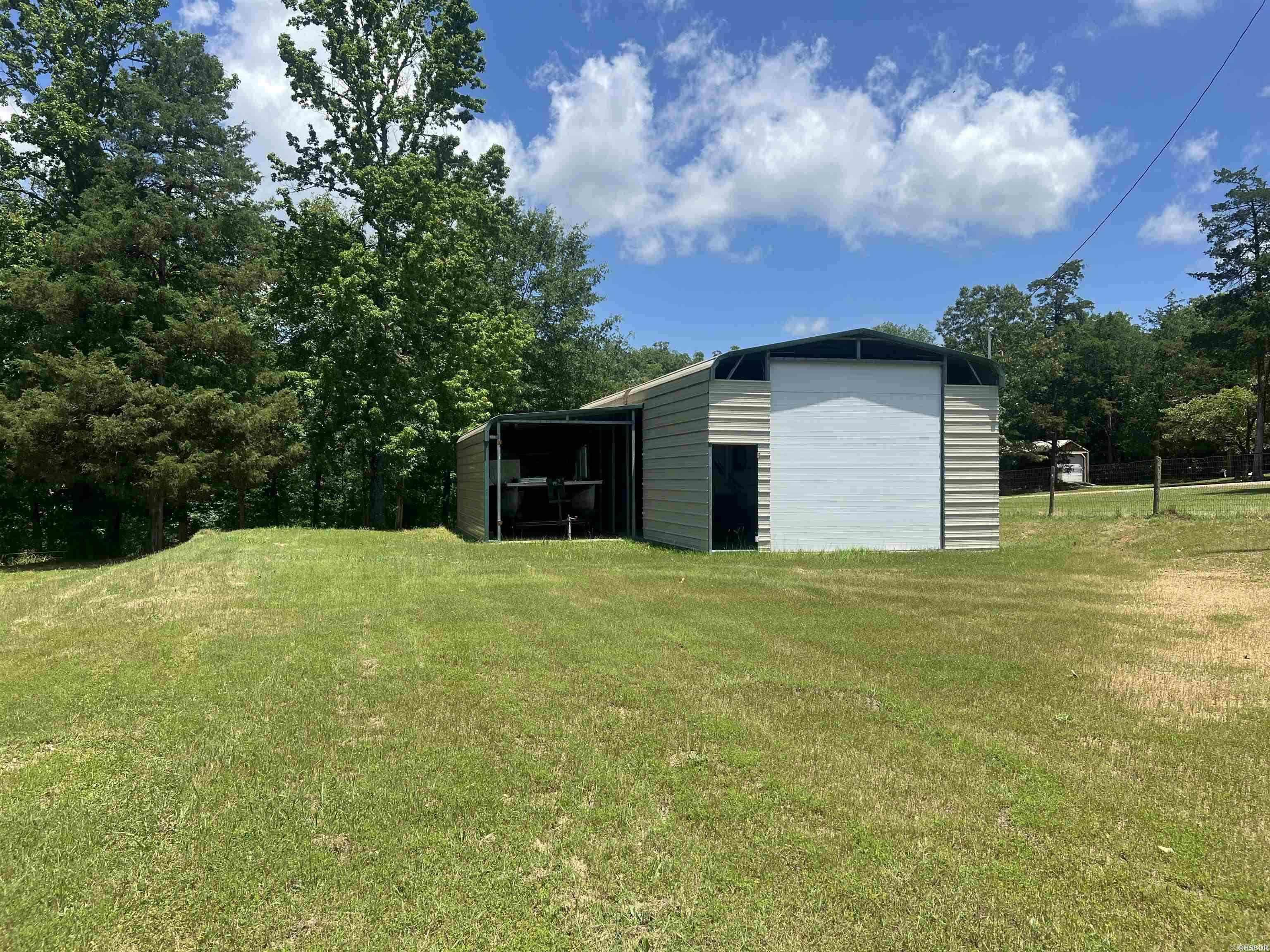 Nestled near the Big Mazarn area, this spacious and level property offers an excellent opportunity for your next investment or future homesite. Already equipped with a storage building featuring electricity—perfect for housing a boat, camper, or other recreational gear—this lot is primed for convenience and adventure. Whether you're dreaming of building a cozy cabin retreat or a permanent residence, this peaceful setting provides the ideal canvas. Just minutes from the lake, you'll enjoy easy access to fishing, boating, and all the natural beauty the area has to offer. With its location and potential, this property is a smart choice for investors, outdoor enthusiasts, or anyone seeking a quiet escape close to the water. Building measures 20 X 41 X 11 on one side and 12 X 26 8 on other side.