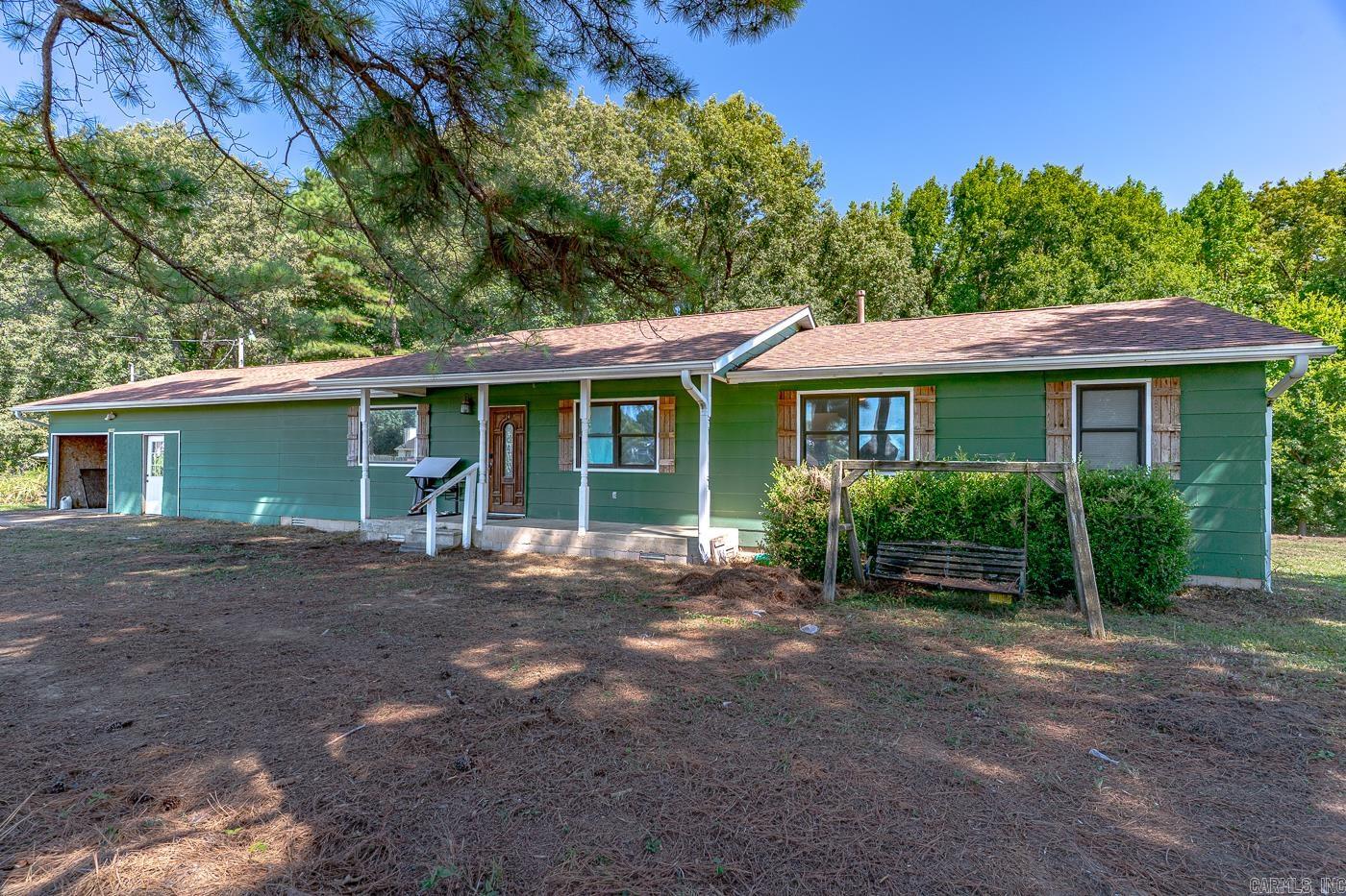 Welcome to Market 2086 County Road 318 of Jonesboro, Arkansas within the Westside School District. Situated on 2.28 +/- acres is a 1,456 sf Ranch Rambler wrapped in wood, topped with 2023 architectural shingles, and accented by shutters, gutters, covered front porch, open 2 car garage, and mature landscaping. The interior features a large living room, eat-in kitchen/dining combo w/ stainless steel appliances and access to the exterior, Master bedroom w/ en-suite that includes a walk-in shower & jet tub, 3 generous spare bedrooms, spare bathroom w/ walk-in shower, and laundry room. The exterior holds mature shade trees, 24 X 36 primitive barn, outbuilding, and wire fencing. The Seller loves the ample storage that the property provides, deer and other wildlife that frequent the property, and the comforts of the country. Experience the stillness of the country while being conveniently located just minutes from favorite local amenities. Call today to schedule your tour and make this house your home.