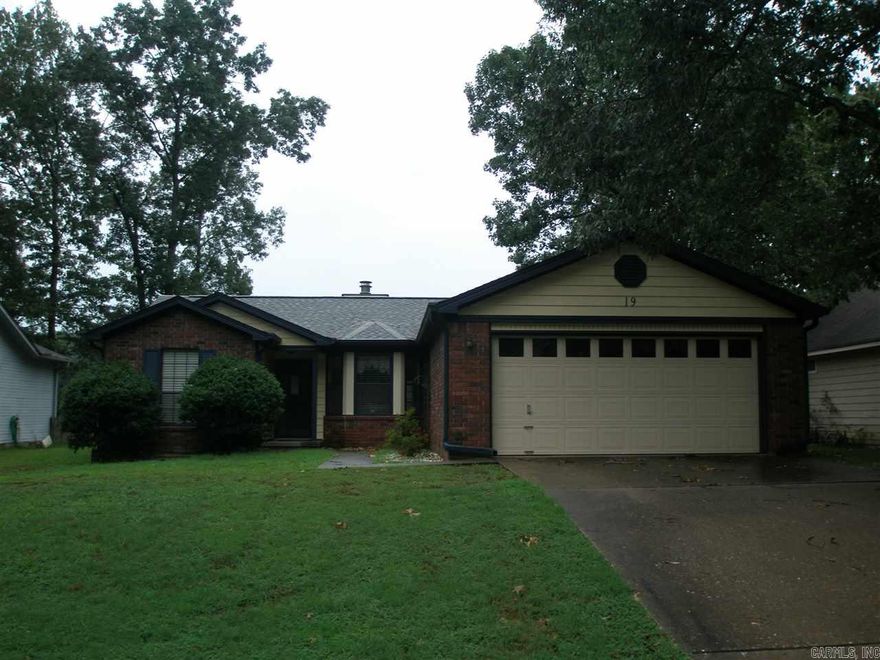 Well built home, slab, 3/2 split open floor plan, eat-in kitchen. Vaulted ceiling in den with gas log fireplace, newer roof and siding, gutters, 2 car garage, ceiling fans, blinds, walk-through laundry, refrigerator to stay, covered patio, fantastic view overlooks a farm with a pond. Needs some TLC and updating. Priced to sell "AS-IS" so buyer can do their own updates. All situated on 1/4 acre lot. Personal property can convey excluding master bed suite, living room table, and garage work bench.