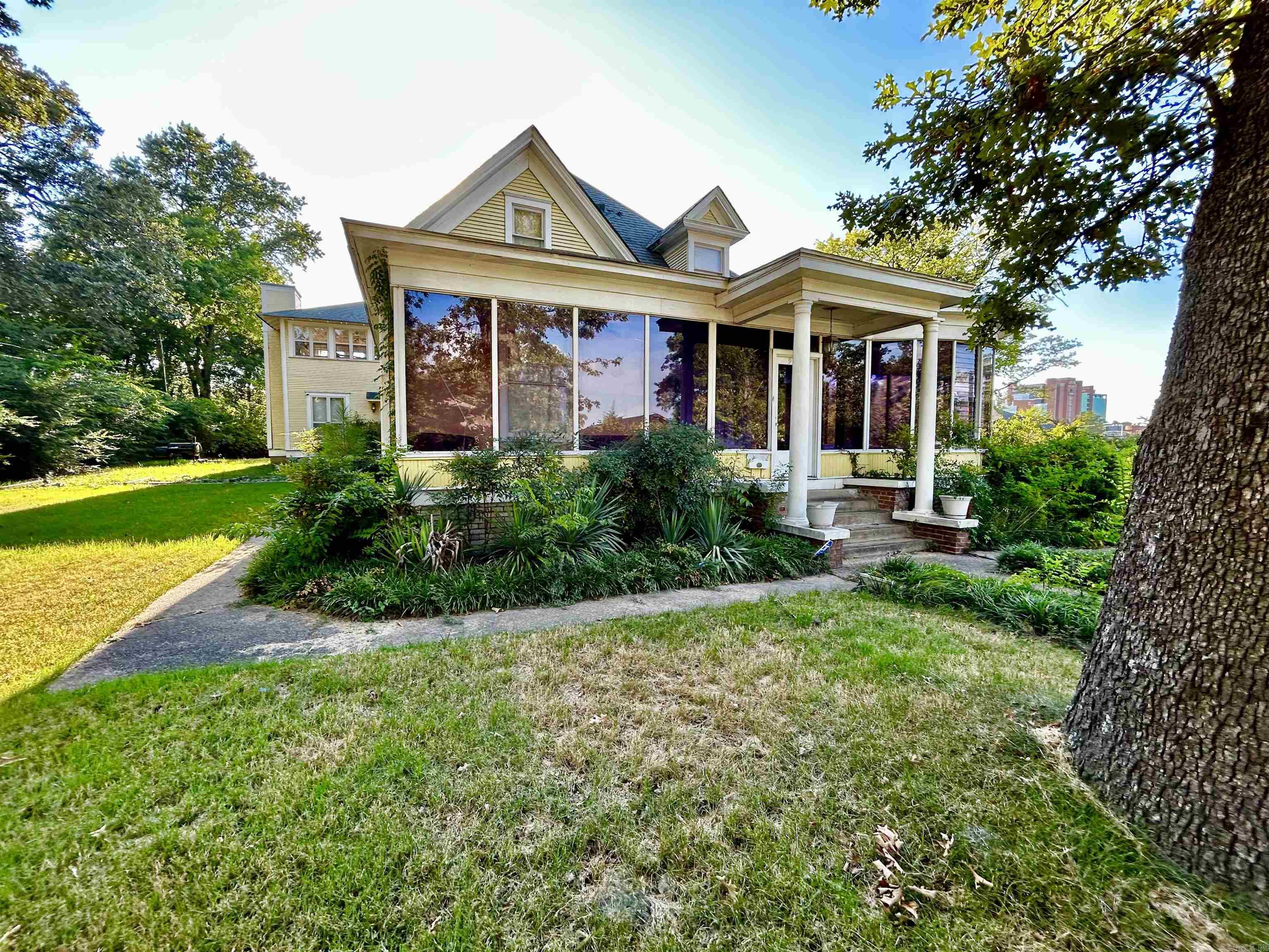 What a grand old house! This one has so much potential, it just needs someone to give it some love. Tall ceilings, pocket doors, original hardwood floors, a lovely sunporch. Needs to be financed Conventional loan or cash. It is in an estate, but everything is done and it's ready for an easy close. Sold AS-IS with no disclosure available. Agents: Please see remarks!