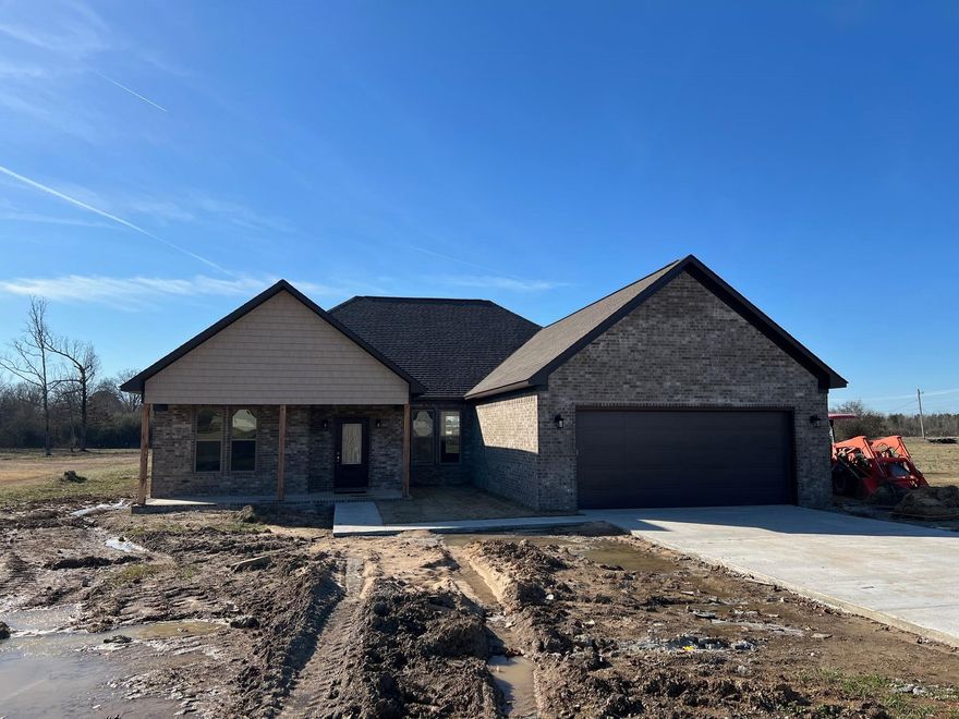 New Construction Home.  Three Bedrooms Two Baths plus a office. This home is over 1900 Sq feet which means big spacious rooms.  Vaulted ceiling in the living room. Kitchen has a 9 foot granite bar overlooking the living room.  Tankless hot water heater. Soaker tub in the master, walk in tile shower in master.  Covered front and back porches. This is a Nice Custom home.  Sod will be laid in the yard before closing.