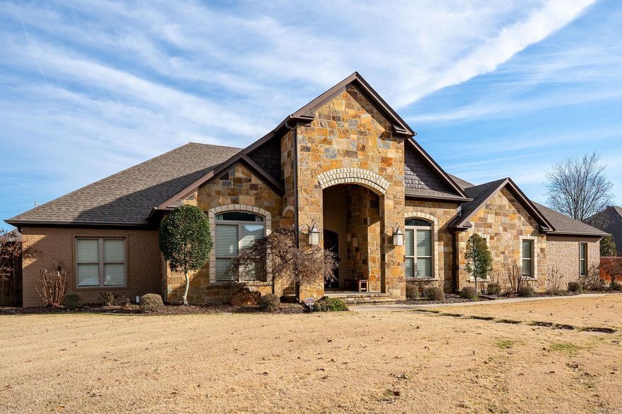 Immaculate 4-bedroom home with fabulous flagstone patio and lagoon pool with waterfall. 12', 10', & 9' ceilings.  Distressed floors, carpet in bedrooms and tile in wet areas. Granite in kitchen with a large island and stainless appliances. Large pantry. The split floor plan has 3 bedrooms on one side with a jack-in-jill shared bathroom with private vanities and walk-in closets. The master is oversized with a walk-in shower, tub, double sinks, and a large closet. Office/work-out room has closet. Large 3 car garage features 1/2 bath with pool access and safe room. Walk up to the oversized floored attic. Two HVAC High efficiency units with pool access and safe room. Walk up to the oversized floored attic. Two HVAC High efficiency units with one replaced 6 months ago.