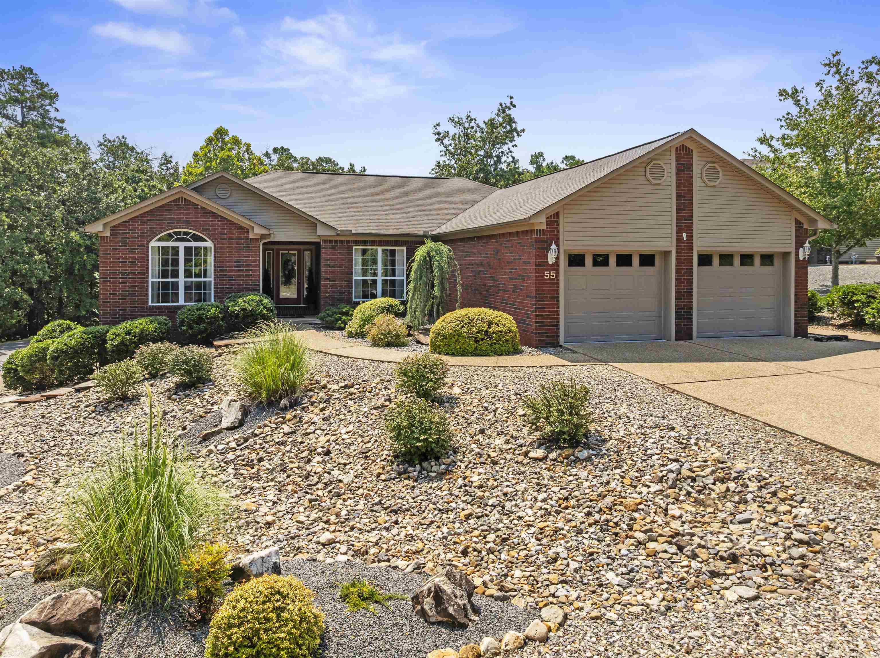 Beautiful home near Ponce Golf Course in Hot Springs Village! Come see this lovely 3 Bed, 2 Bath home all on one level. Situated on a corner lot with thoughtful landscaping, this home has some extra special features: upgraded shingles, heated/cooled garage, lower level garage with separate driveway, flat driveway/parking, remodeled kitchen, wet bar, large breakfast room with extra barstool seating, dedicated dining area, split floorplan for privacy, deck with composite decking, pergola and open deck area. This home has everything you need for easy village living! New Member Buy in fee due at closing.