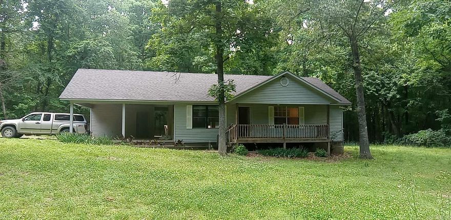 Come see this beautifully finished home on a large lot with porch made for sitting.  2 bed, 2 bath, freshly painted and with new flooring.  Make this home yours today!  Large lot and storage in carport.