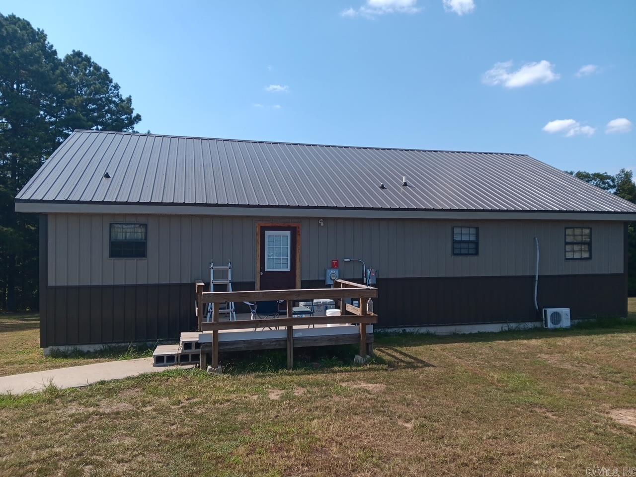 This property in Shirley/Fairfield Bay, Arkansas, is a rare opportunity for buyers seeking a blend of rural charm, modern comforts, and recreational access. With its 20 acres of cross-fenced land, mix of pasture and woods, garden area, pond, creek, and proximity to Fairfield Bay Marina and SouthFork Boat launch ramp, it caters to a variety of lifestyles, from farming to leisure. The custom-finished cedar home features new board and batten siding(2025) and new metal roof(2025), a open floor plan, and large deck add to its allure, while the wide open night sky for stargazing provides a unique, celestial experience. Potential buyers are encouraged to schedule a showing to explore this piece of Arkansas's natural beauty and make it their forever home.