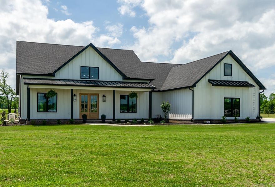 This New Home has all the added extras you could ever desire! The moment you enter every aspect is statement making! Floor to ceiling fireplace, the beautiful chandelier is showcased by the 20 ft ceilings, the natural light floods the living space through the grand 8ft Windsor patio doors! The huge kitchen island open to the living and dining area is as functional as it is beautiful! The kitchen boast the most high end appliances with tons of storage with a walk in pantry with outlets. The primary bedroom and bath are show stoppers with a beautiful fireplace, soaker tub and custom shower, where you will also find a safe room that is FEMA approved equipped with heat and air. Outside you have extended living space with 1000 sq ft of outdoor living as you look over your almost 10 acres of useful land fenced and cross fenced , a shop for work and storage with full living quarters, a barn finished with cedar walls with power and water with a 1/2 acre stocked pond to complete this beautiful setting! Wifi controlled whole home generator to insure comfort no matter what nature brings! Agents please see the attached upgrades and survey and confidential notes!