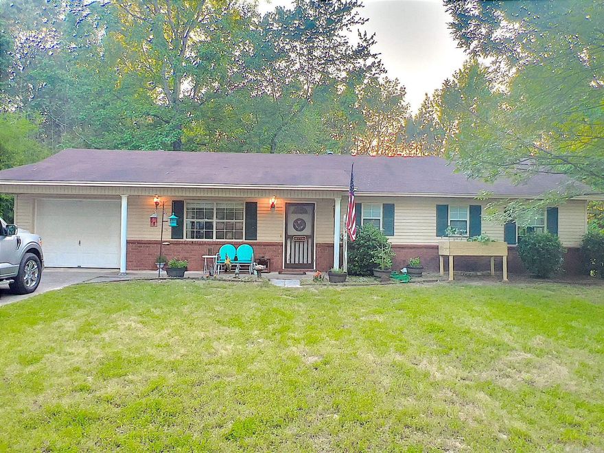 Nestled amidst serene landscapes, this idyllic home boasts mature trees, a quaint chicken coop and a versatile outbuilding perfect for the hobbyist or storage. Enjoy the luxury of newer appliances, HVAC and Hot Water Tank. Brand new roof being installed before sale--Hurry and you can pick your color. Embrace the tranquility of rural living without sacrificing modern convenience. Don't miss your chance to own this slice of paradise! Bryant Schools.