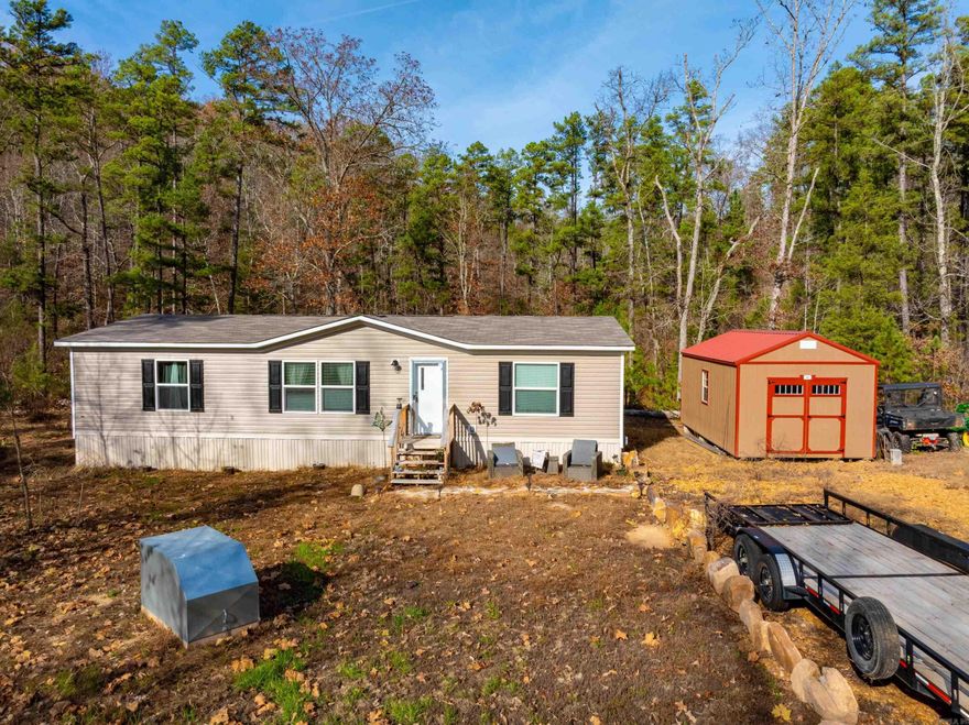 If you’ve been searching for a hunting tract near the White River, a peaceful place to call home, or the perfect Ozark getaway, this 45+/- acre property near Calico Rock, Arkansas checks every box. Located just minutes from town and the world-famous White River, this property offers privacy, wildlife, and modern living in one package. A 2024 double-wide home sits on the property and offers a clean, move-in-ready interior ideal for full-time living, a weekend retreat, or a hunting base camp. Features include an open-concept living, kitchen, and dining area, spacious bedrooms, a like-new interior, a storage shed beside the home, and a parking pad for vehicles or ATVs. The land offers excellent diversity with rolling terrain, hardwood timber, bedding areas, and natural cover, creating ideal habitat for wildlife.Whitetail deer, large tom turkeys, black bear, and small game are commonly seen.An additional shed farther into the property provides convenient storage for hunting equipment, feed, or ATVs. Enjoy close proximity to trout fishing on the White River, along with access to Mountain View, Mountain Home, Blanchard Springs, and nearby amenities—while still enjoying complete seclusion