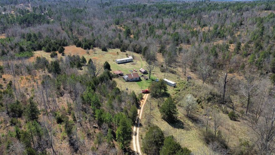 65 +/- Acres with Creek, Pond, and Fixer-Upper Mobile Home in Arkansas!  This 65 +/- acre property in Oxford, Arkansas, offers a mix of open fields and wooded areas, making it an excellent opportunity for hunting, farming, or building. The land features a year-round spring-fed creek, a pond, and large fields ideal for livestock or recreational use.  A 960 sq. ft. single-wide mobile home, built in 1988, sits on the property and is livable but needs some work. Additionally, there is an old house that will need to be torn down. Utilities are already in place, including power and city water.  Located just minutes from Oxford, this property provides a great combination of privacy and convenience. Whether you're looking for a hunting retreat, farmland, or a homesite with utilities already in place, this acreage has plenty of potential. PRICED TO SELL AT $149,900.