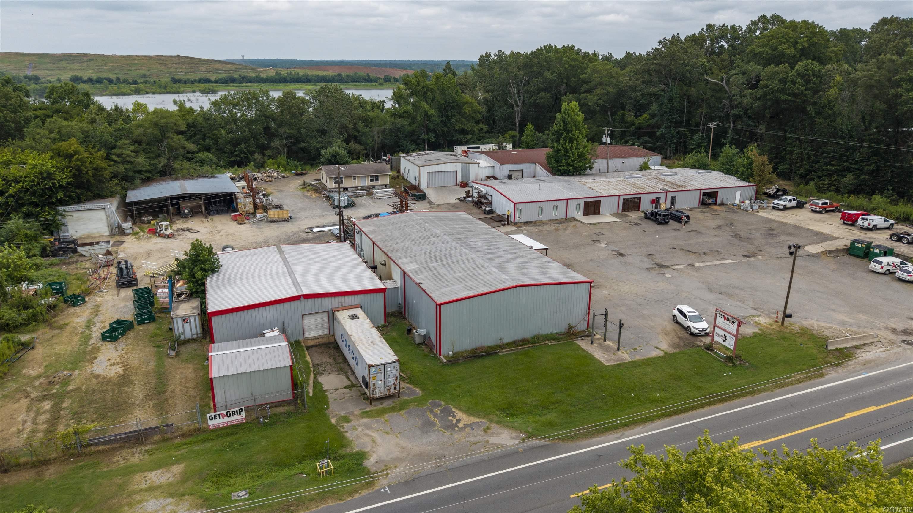 Rare commercial opportunity on 3.77 acres in North Little Rock/Jacksonville Area featuring 6 heated metal buildings totaling over 27,000 SF, plus a 1,200 SF unfinished home and 60'x60' covered storage area. 490' Frontage on AR Hwy 161. Buildings 1 & 2 include a 60'x150' and attached 60'x120' metal structure with loading dock, powder coating oven, 3-phase 480V power, and upstairs apartment. Building 3 is 50āx60ā, Building 4 is 50āx100ā, Building 5 is 50āx55āāall heated. Building 6 is a 30āx60ā insulated, heated silo. Some buildings have air-conditioned space. Ideal for manufacturing, warehouse, distribution, or contractor use. Convenient to I-440, I-40, Little Rock Port, and airport.