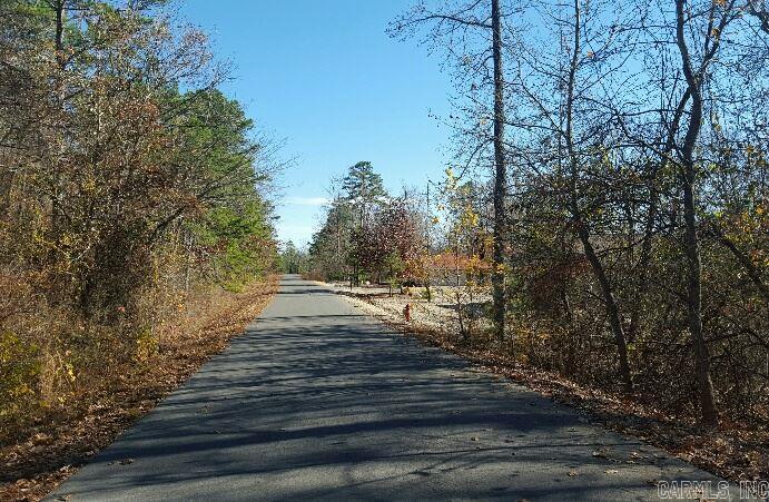 Nice wooded home site near newer homes in the Nation's Largest Gated Community featuring 9 championship golf courses, 11 lakes, mile after mile of walking trails, tennis center, state-of-the-art fitness center, and breathtaking mountain vistas. Build your dream home now!