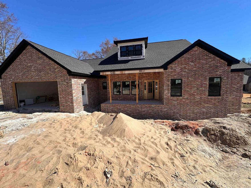 Welcome home to this show-stopping new construction in the highly sought-after Hills Subdivision! This 3-bedroom, 2.5-bathroom home is designed to impress with its beautiful brick exterior and inviting covered front and back porches—perfect for enjoying peaceful mornings and relaxing evenings. Step inside to a thoughtfully designed split floor plan featuring tray ceilings that add a touch of elegance and spaciousness. The kitchen is a dream, boasting gorgeous quartz countertops and a walk-in pantry for ample storage. The primary suite is a private retreat, offering a luxurious ensuite bath and a large walk-in closet.Located just minutes from Lakeside Schools, this home offers both convenience and style in a prime location. Don’t miss your chance to own this stunning new build—schedule your showing today!
