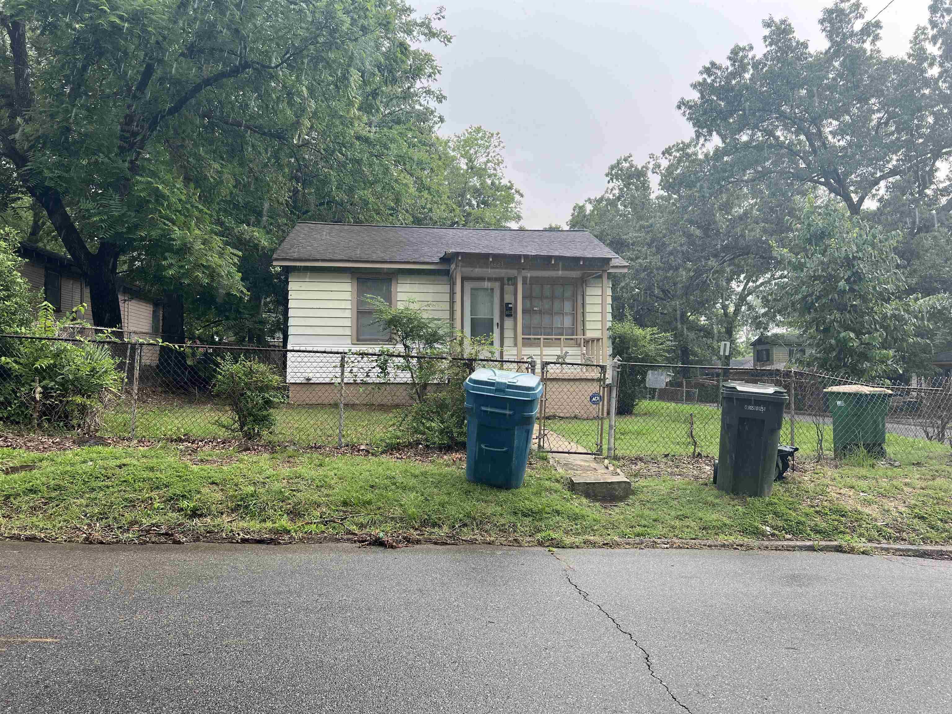 Adorable, updated little bungalow SUPER close to UALR! One bedroom/one bath with a separate dining space. A deep lot gives you a great backyard space and is fully fenced and on a corner lot! The interior features new flooring, new paint, updated vanity in bath, and new fixtures. New mini-split works great! Washer and dryer stay. This property is perfect for a student or faculty member. As an investment it would make a great rental property! Front and back entrances with storm/screen doors. No seller property disclosure.