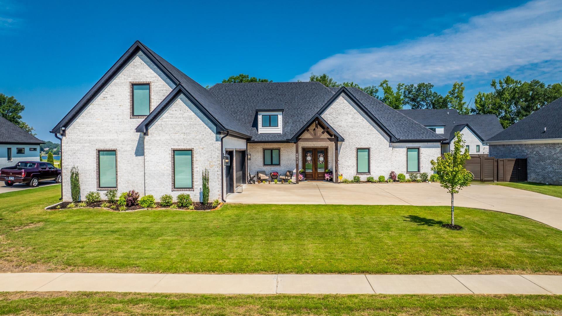 Exquisite 4-bedroom, 3-bath home nestled in the heart of Saline County, within the exclusive gated community of the Pointe at Hurricane Lake Estates. This stunning property offers a spacious office, 4th bedroom/bonus room w full bath above 3 car garage. The kitchen is a chef's dream; with a concealed pantry, natural gas range & a layout designed for open, airy living. Private swimming pool with sun tanning ledge, fully fenced, outdoor covered fireplace on porch, dog door for easy puppy access and additional landscaping providing the perfect oasis for unwinding or entertaining guests. Courtyard style parking w additional pad for boat storage and irrigation s views of the lake w access to a walking trail right from your doorstep. Array of neighborhood amenities including a swimming pool, playground, tennis courts, and lake access, ensuring endless opportunities for recreation and relaxation. Plus, year around neighborhood events. Energy efficient. featuring foam insulation, energy-efficient windows & doors, w a tankless water heater. Split floor plan, laundry connects to primary closet, stunning pass-through shower, accent wood on ceilings, AND SO MUCH MORE! Agents see remarks