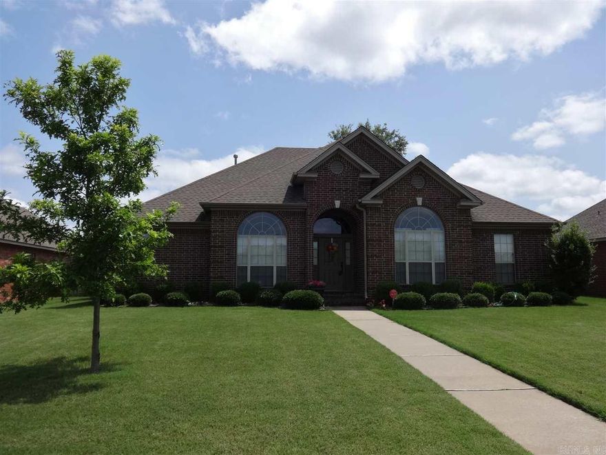 Located in golf course neighborhood this 4 Bedroom/2 Bath features new hand scraped hard wood floors in the living room, dining room and entry. Living room features gas log burning fireplace. Beautiful fully fenced  back yard with extra landscaping, with water feature and covered patio. Rear entry garage .  see agent remarks regarding personal property that does not convey