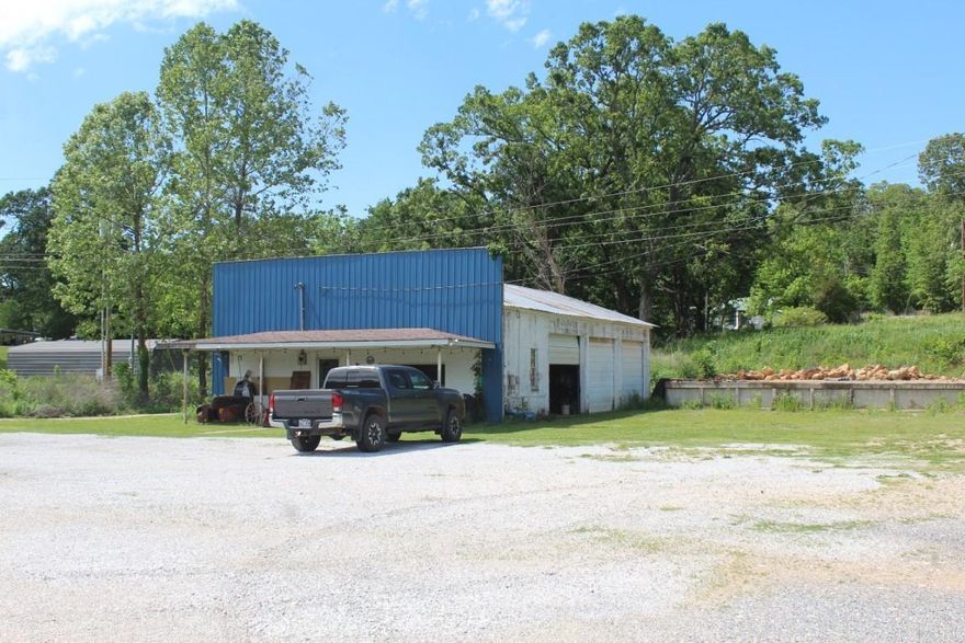 No. 02376  COMMERCIAL BUILDING FOR SALE IN MARSHALL ARKANSAS.  Located on busy hwy 65 with great visibility.  Once a repair shop and car lot, now an empty building waiting on your imagination.   1856 sq ft on a 1.68 acre lot.  $123,000