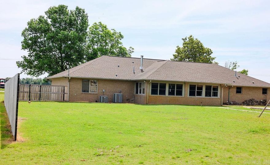 2500 Sq/Ft Home & 50x100 Shop on 2 Acres in Des Arc  Enjoy ultimate privacy on 2 acres with no neighbors, surrounded by crop fields and mature timber.  The Home: This 3-bed, 3-bath country home features a 4th flex/mudroom, large sunroom and massive 1,000+ sq/ft open-concept great room with 12’ vaulted board and batten ceilings. Stay cozy with a cast-iron wood stove. The updated kitchen boasts a 48” built-in fridge, new countertops, and a propane range. The brick finished 2-car garage is heat/ac ducted. Extensively updated with a new roof coming 5/27/26, updated bathrooms, new flooring, LED lighting, and thermal shades.  The Shop & Land - The 50x100 insulated shop includes a heated/cooled office, bathroom, and a 20x80 slab. An additional 22x60 concrete slab offers 220V power. Property features a private well (needs new pump), two septic systems, generator hookup, privacy fence, raised garden beds, and a treehouse.  Location - Minutes from outdoor recreation and convenience. Located 5 miles from I-40 at Hazen and Wattensaw Bayou, and 6 miles from Des Arc Schools and White River Access. Only 36 miles to North Little Rock.