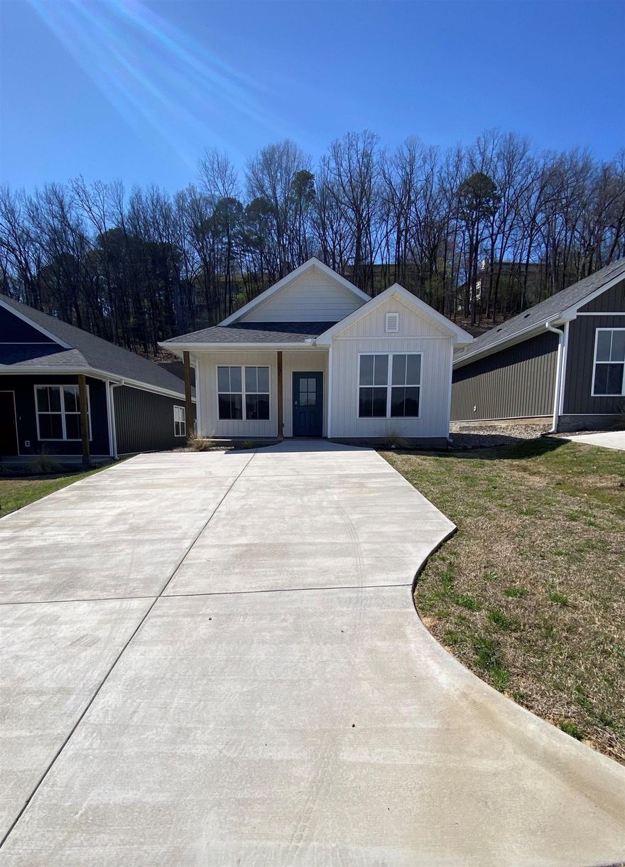 BRAND NEW SUBDIVISION AND a brand new, never-lived-in residence off Rodney Parham Rd., near Leawood & Breckenridge. Come take a look at Hillcreek Village! This beautifully thought-out development includes luxurious finishes throughout each home; Along with a dog park, manicured green space area and a pickleball court just steps away! This charming subdivision boasts individual parking pads, single level entryways, and space for relaxing or entertaining!  Custom built-in closets, soft close cabinets, keyless entry access and modern finishes.  Enjoy the peace of mind that comes with a brand-new home, complete with a 1-year builder's warranty. Providing easy access to all that Little Rock has to offer in this convenient location! - Granite Countertops - Stainless Appliances- All Electric - Full Size Laundry Room - Luxury Vinyl Plank Flooring - Walk-In Closets - Centrally Located to Transit.  Seller to offer up to a $2,500 closing cost credit and privacy fence.  NOTE:  Interior pictures are of the model home in the subdivision showcasing the living space and features of homes available for purchase.