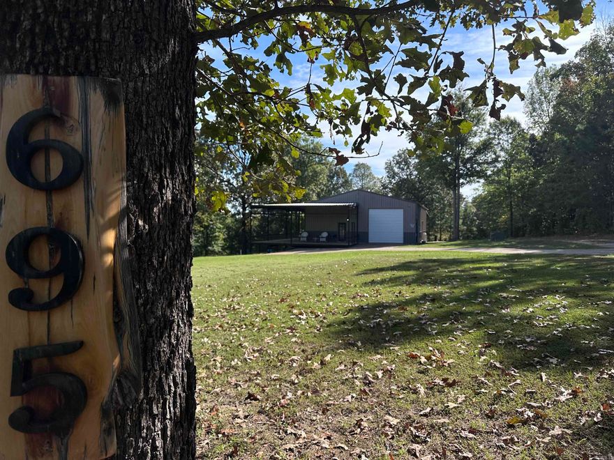 This one of a kind home is what dreams are made of! There are rolling hills that greet you as you drive up, along with massive porches that will not only allow you to spend time taking in the view, but will also double as living and entertaining space. Step inside this home and be truly blown away! The gourmet kitchen is only the beginning here! Top notch finishes everywhere and a cool modern vibe makes this country home all city. The living room takes the view and then frames it with the most amazing doors. Master suite is downstairs, featuring an amazing & huge master bath. Upstairs you'll find 3 bedrooms. There is a garage and 2 car carport attached, office and garage/shop space. There are also two laundry areas for your convenience. This listing is like no other! Come and see for yourself!