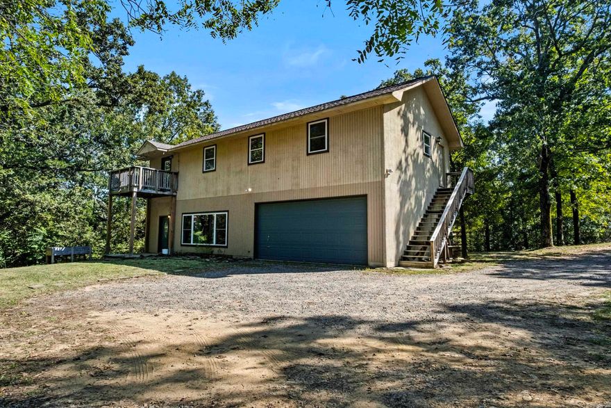 Beautifully remodeled and move-in ready 2-story home on 1.7 acres just off West Country Club Road, within close distance to the Searcy Country Club! Primary suite with full bathroom downstairs plus 3 large bedrooms and 2 full baths up, including a 2nd primary with private deck.  Granite countertops, stainless appliances, oversized 2-car garage with great storage, and a spacious laundry/mudroom that could serve as office space. Two bedrooms upstairs can share bathroom separated by sliding shelf & mirror. . Plenty of room to add a garbage or shop! Agents see remarks.