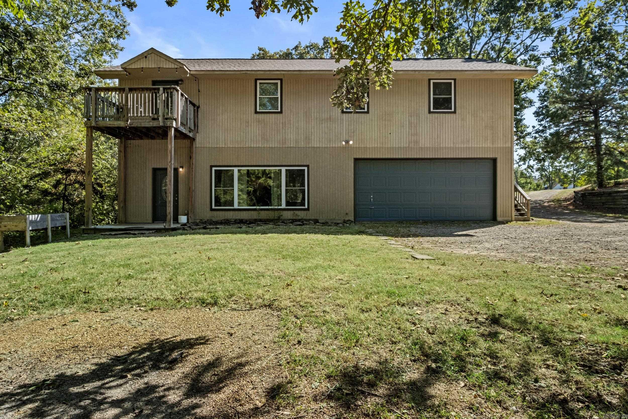 Beautifully remodeled and move-in ready 2-story home on 1.7 acres just off West Country Club Road, within close distance to the Searcy Country Club! Primary suite with full bathroom downstairs plus 3 large bedrooms and 2 full baths up, including a 2nd primary with private deck. Granite countertops, stainless appliances, oversized 2-car garage with great storage, and a spacious laundry/mudroom that could serve as office space. Roof 2019, HVAC & water heater 2018. Plenty of room to add another home or shop!