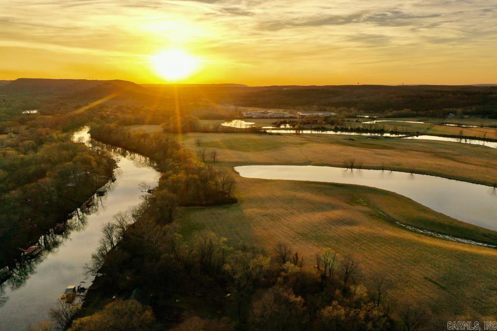 Nestled in the heart of Arkansas’ scenic landscape, this extraordinary legacy property offers a rare opportunity to own a slice of paradise just five minutes from Heber Springs. With approximately 0.6 miles of pristine Little Red River frontage, this property provides direct access to some of the world’s most renowned trout fishing—a true angler’s dream. Encompassing vast, pristine pasture grounds, the property showcases lush, well-maintained fields ideal for grazing, recreation, or potential development. Adding to its allure are six stocked ponds, collectively spanning nearly 50 acres, offering abundant fishing opportunities and enhancing the property’s serene beauty. This estate is more than just land—it’s a once-in-a-generation opportunity to own a piece of Arkansas’ natural splendor. Whether you’re seeking a private retreat, a working ranch, or an investment in a high-value recreational property, this exceptional offering promises endless potential. Opportunities like this are exceedingly rare—don’t miss the chance to experience this remarkable property firsthand.