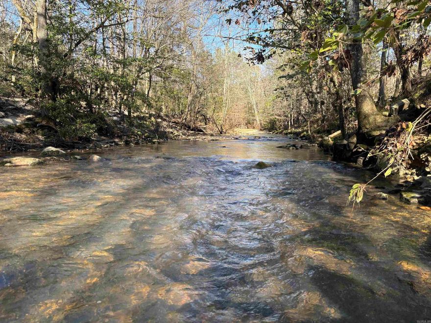 Available now in Howard County: This 16.67± acre parcel offers privacy, abundant wildlife, a year-round creek, and stunning mountain views. Nestled in a wooded area, it includes a planted pine plantation. Conveniently located approximately 11 miles from Lake Greeson, with easy access to Dierks, Umpire, and the Athens area.